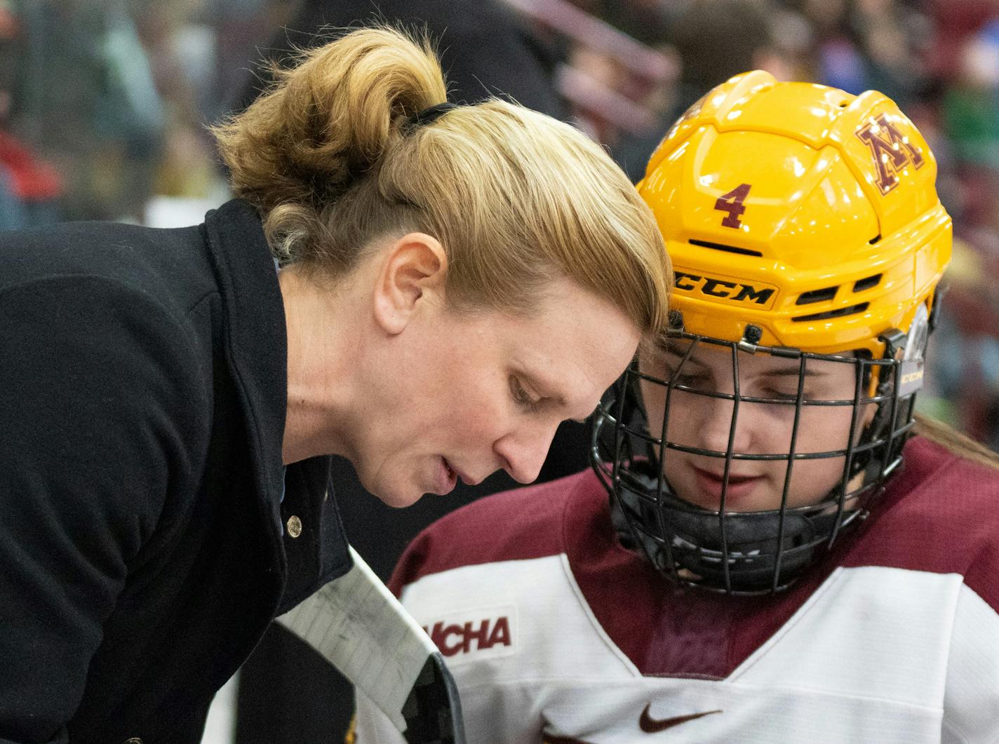 Minnesota associate head coach Natalie Darwitz coaches Minnesota forward Audrey Wethington (4) against Wisconsin in the first period Friday, Feb. 10, 2023 at Ridder Arena in Minneapolis. ]