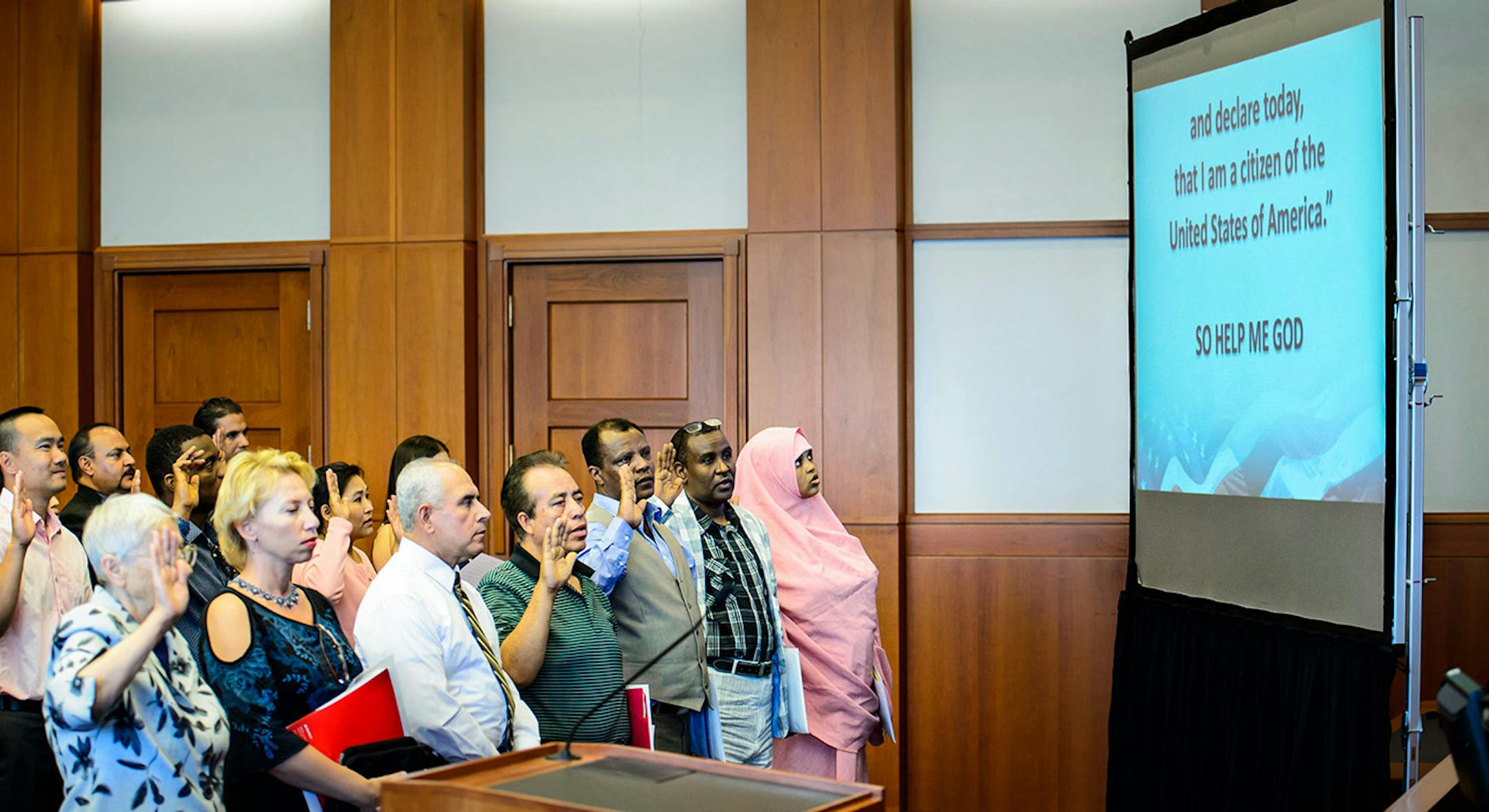 Fifty five people from 22 countries raised their hands to take the Oath of Allegiance Monday afternoon.