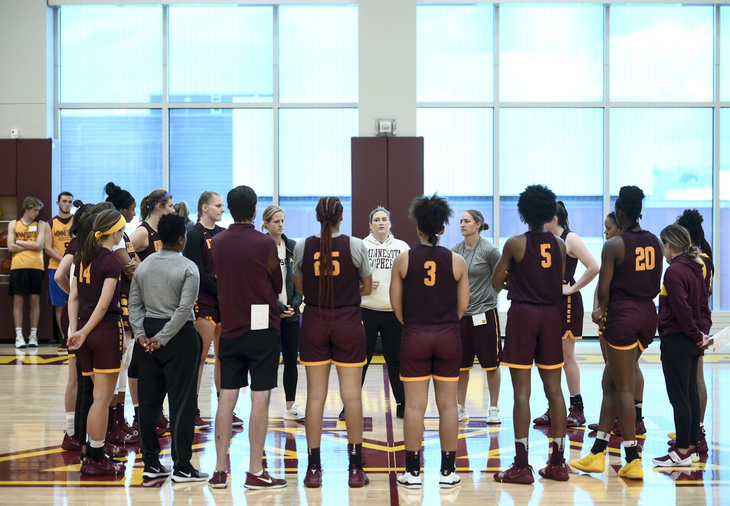 The Gophers women's basketball team huddled up around coach Lindsay Whalen during a practice last month.