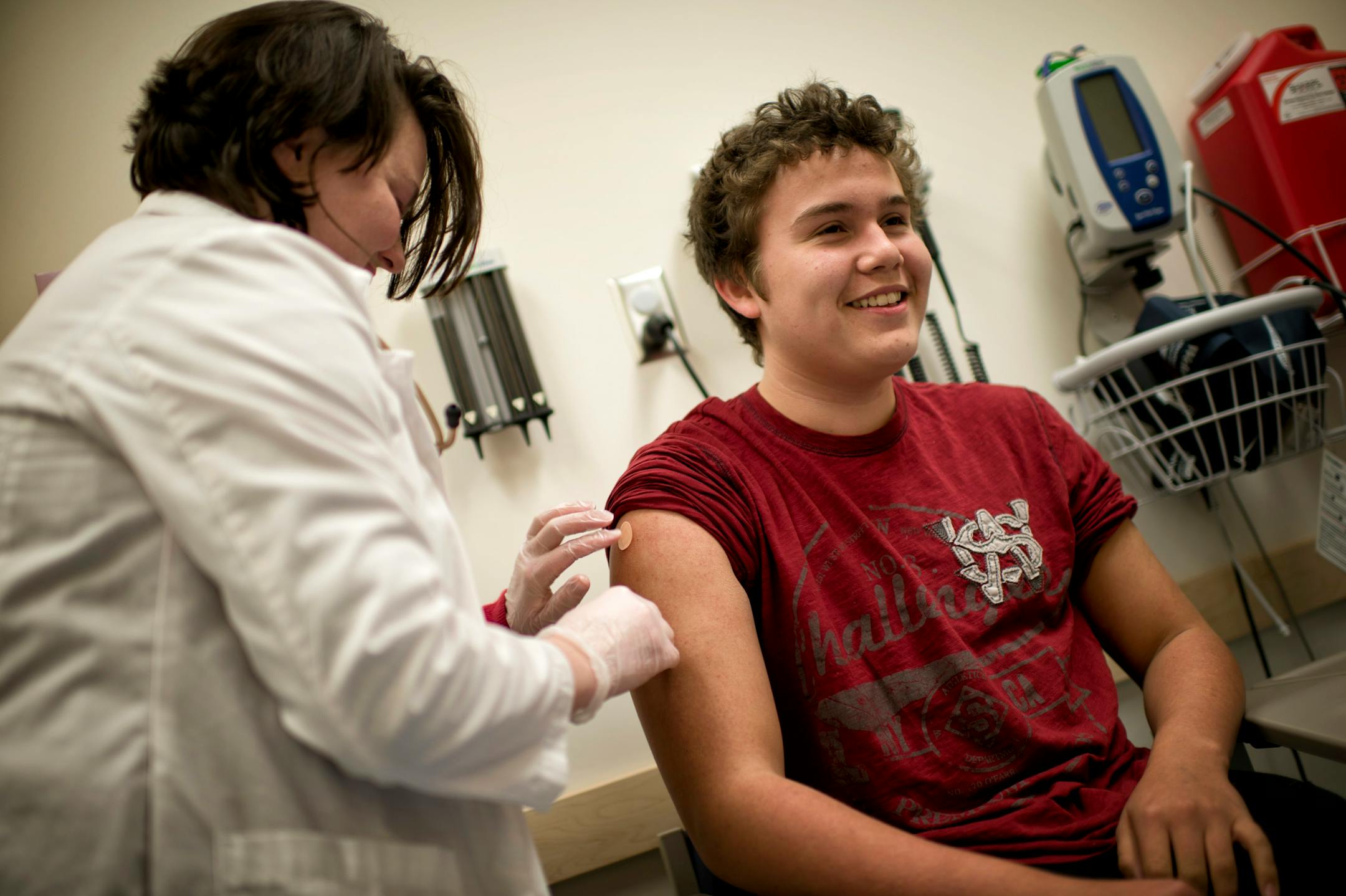 Erik Edin, 15, of Roseville smiled after he got his flu shot from Jackie Chute, nurse practitioner, at Target Clinic in Roseville on Tuesday.