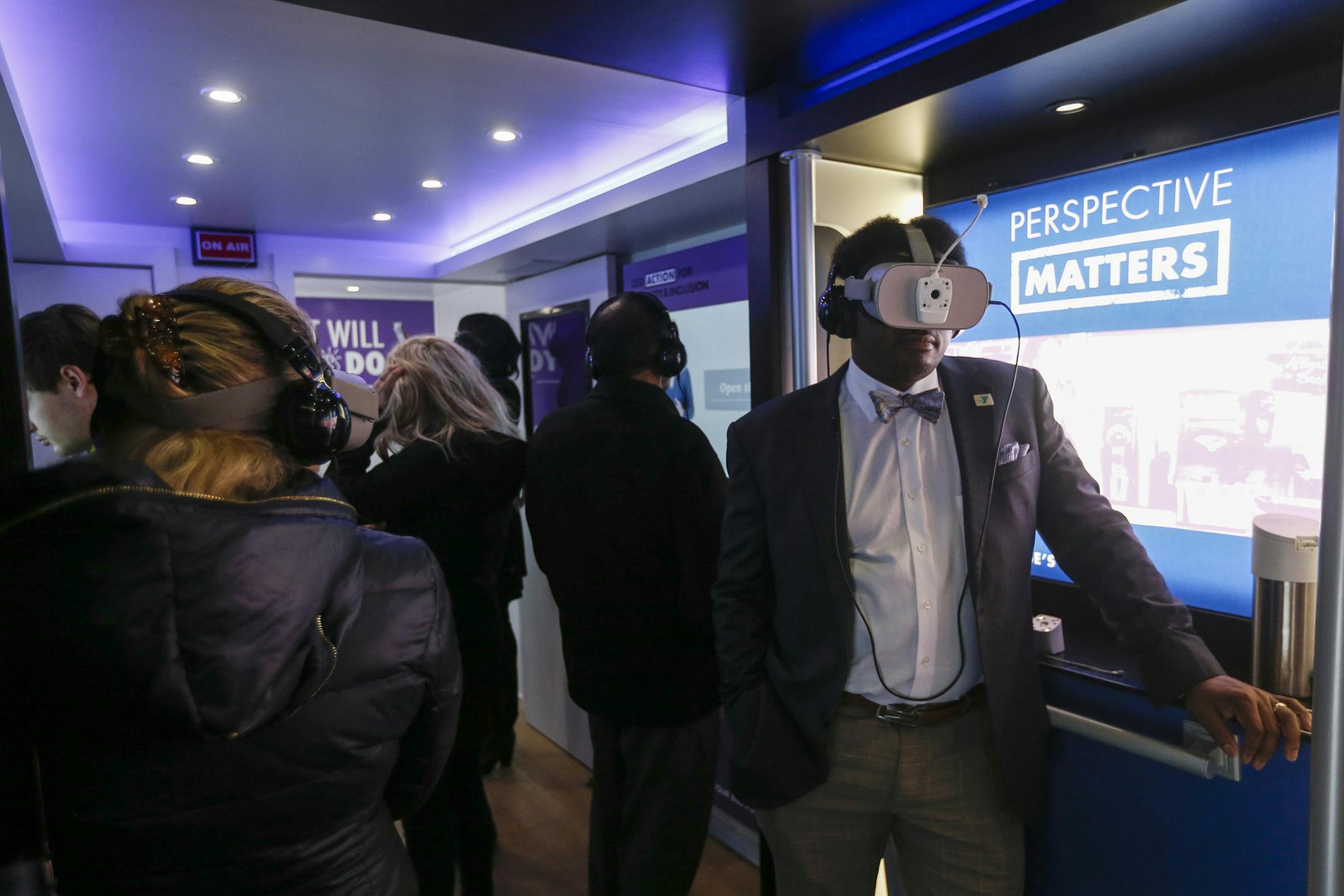Employees use virtual reality devices to experience bias scenarios as they participate in unconscious bias training through the PricewaterhouseCoopers Check Your Blindspots bus tour on Wednesday, Feb. 12, 2020 in downtown Dallas. (Ryan Michalesko/The Dallas Morning News/TNS)