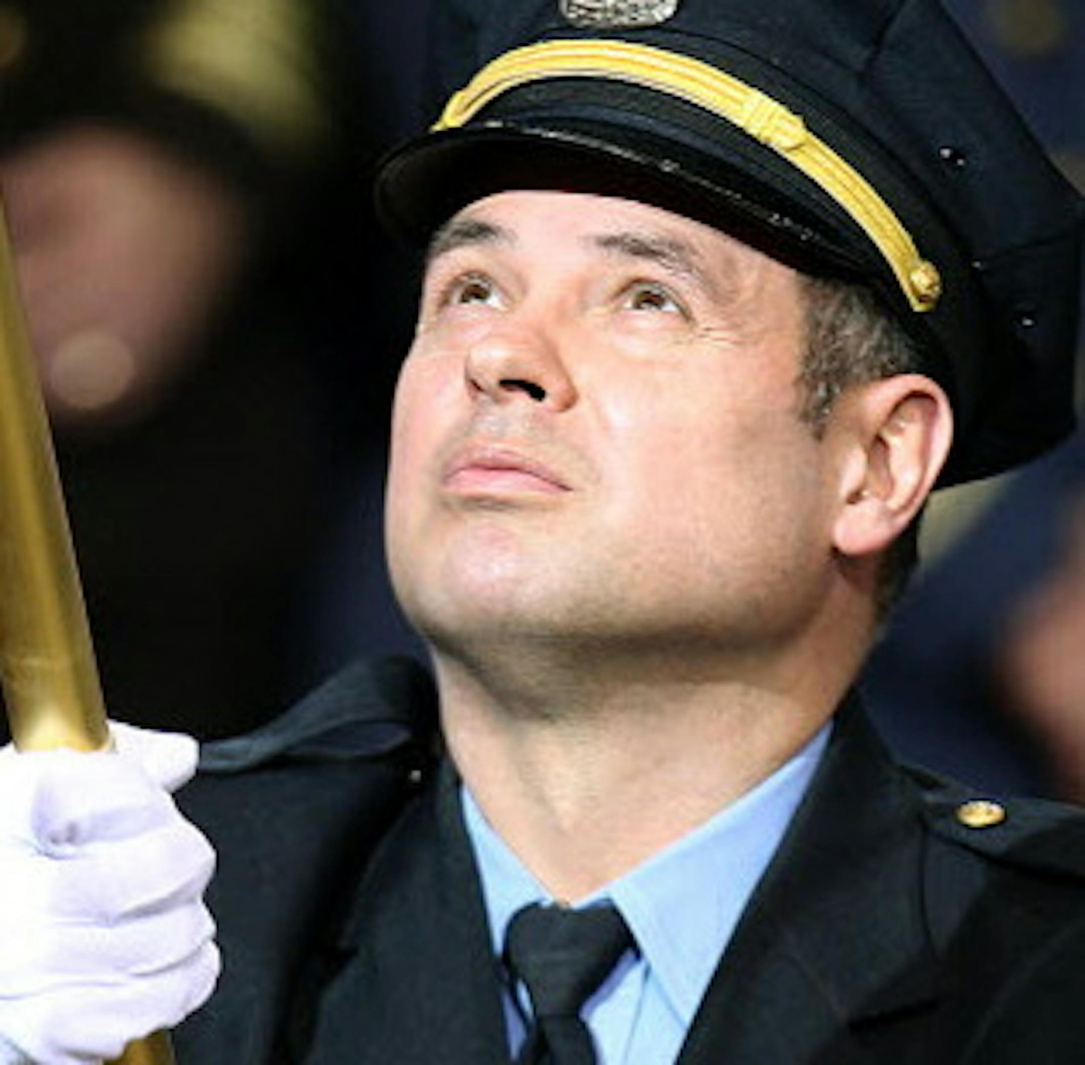 File photo by Elizabeth Flores Minneapolis Police officer Jesse Garcia held the American Flag for the National Anthem before President Obama addressed local victims of gun violence and area police leaders at the Minneapolis Police Department Special Operations Center Monday, February 4, 2013 in Minneapolis, MN. ORG XMIT: MIN1503091502501689