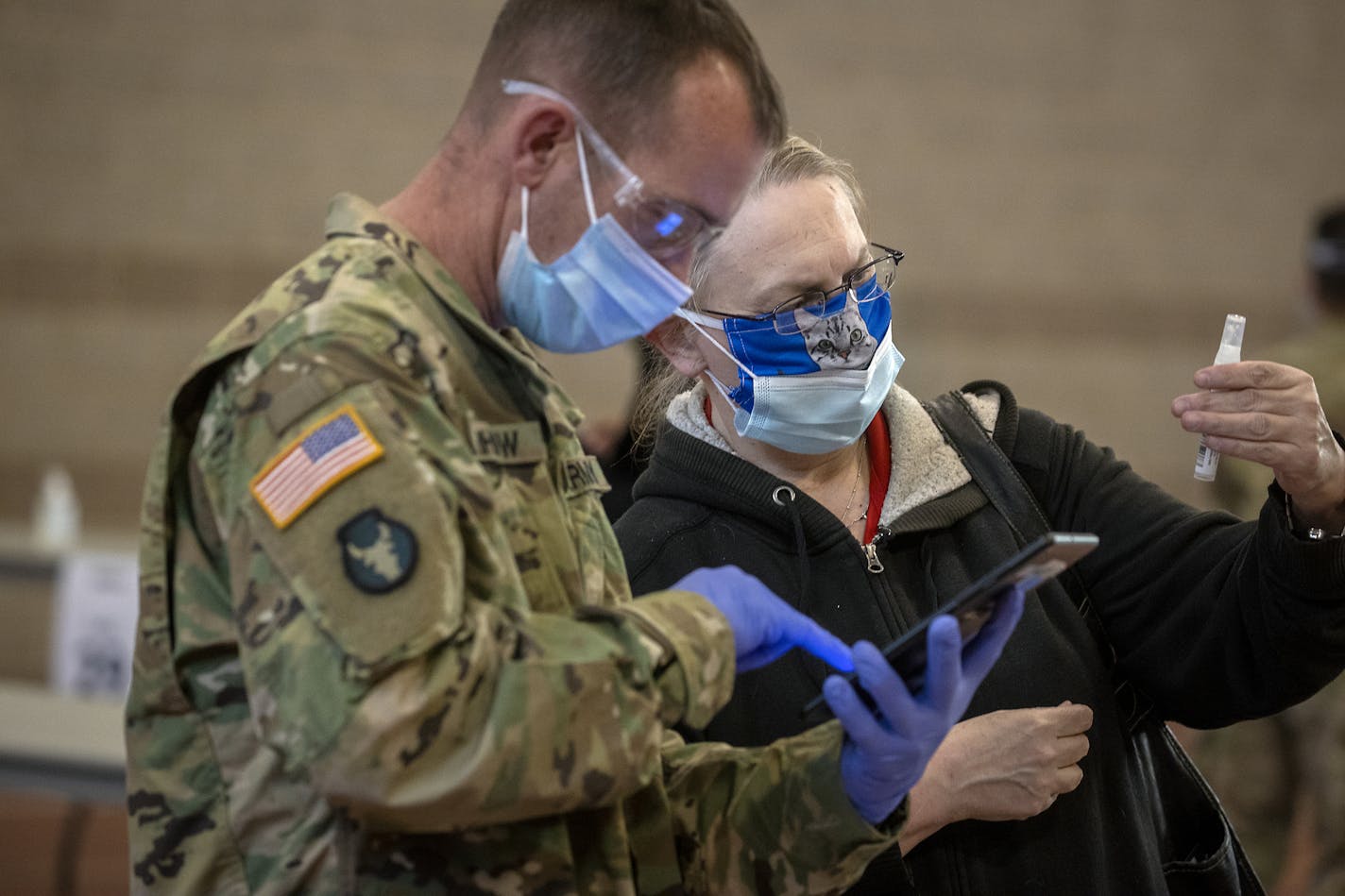 Nick Berhow, left, recently helped Jackie Hampton, right, get tested at the new COVID-19 saliva testing center in Inver Grove Heights. ] ELIZABETH FLORES • liz.flores@startribune.com