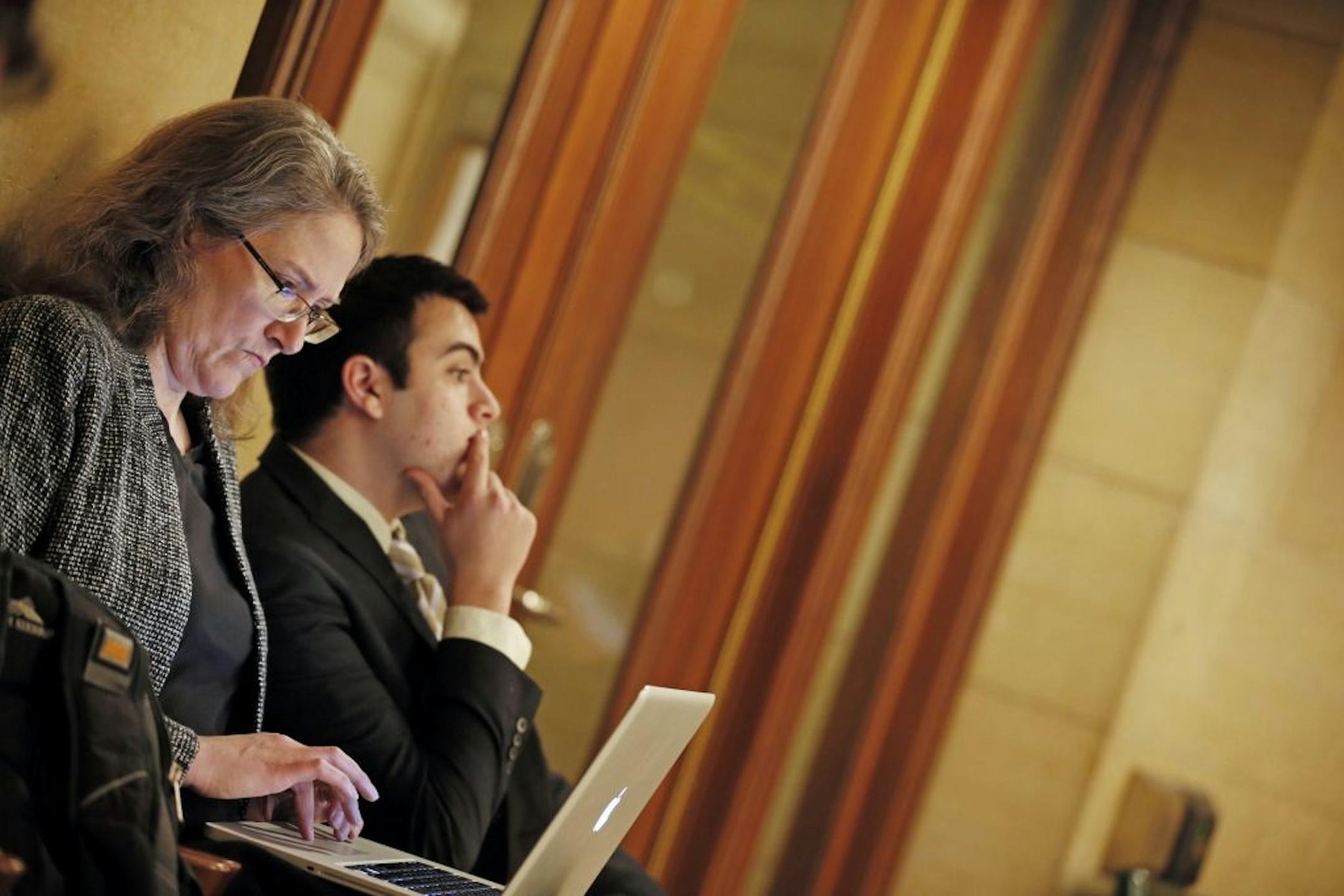 Heather Martens, left, of Protect Minnesota, and Sami Rahamim, son of workplace shooting victim Reuven Rahamim, were at the Capitol on Thursday.