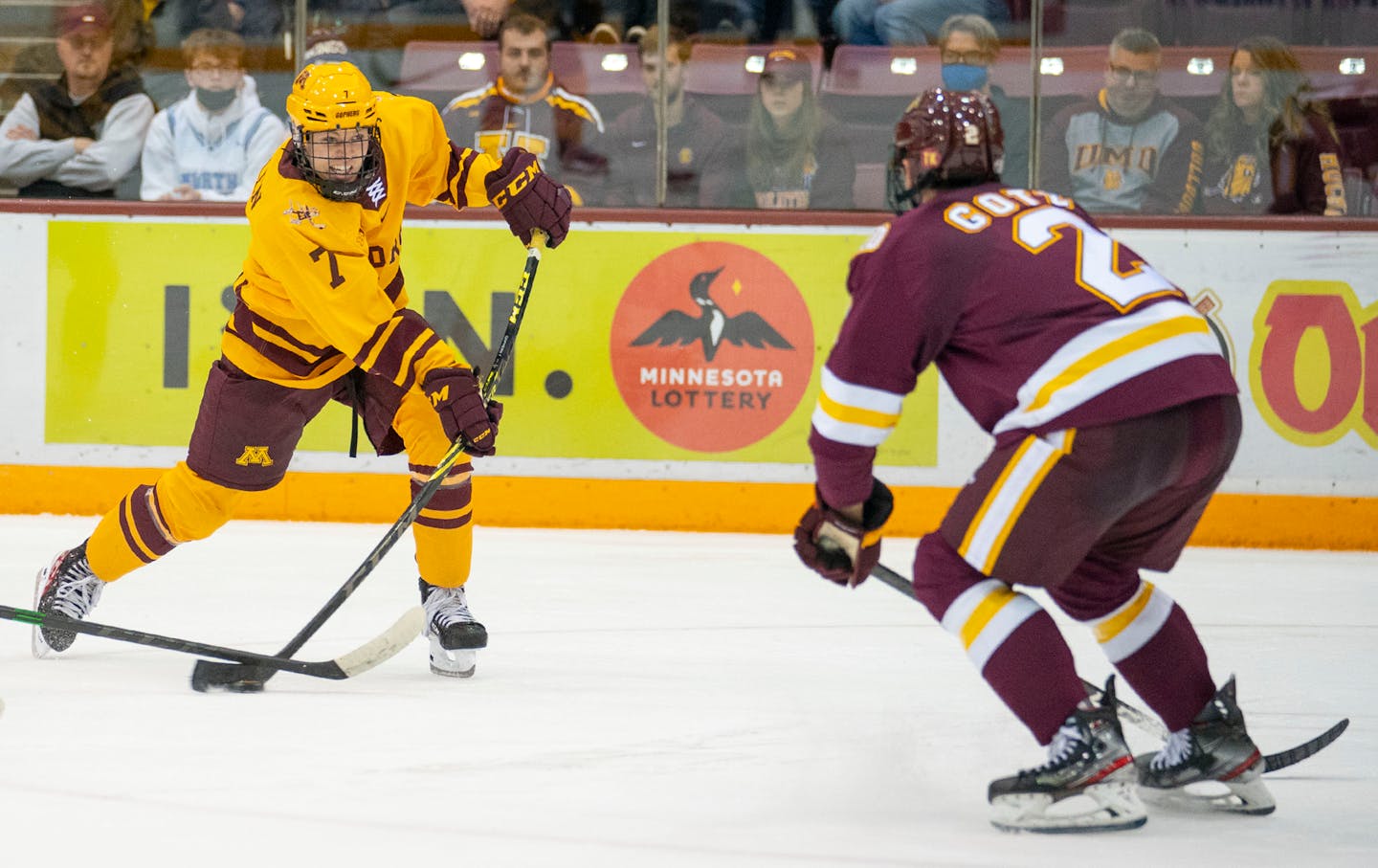 Minnesota forward Aaron Huglen (7) takes a shot while being defended by Minnesota Duluth defenseman Darian Gotz (2) in the third period of their game on Friday, Oct. 22, 2021 at 3M Arena at Mariucci in Minneapolis.