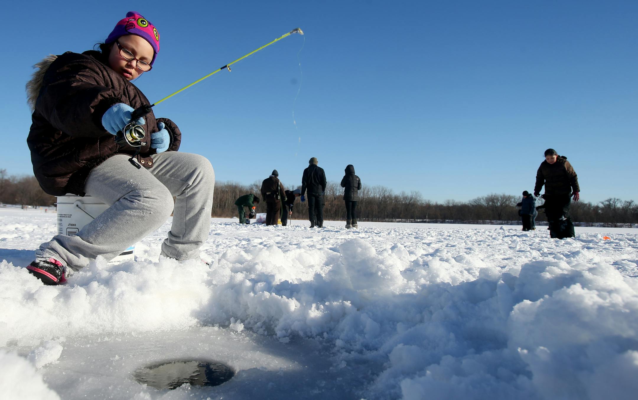 10 year old Anessa Hicks goes ice fishing for the first time. Anessa said, "I've never gone ice fishing before, regular fishing but nerver ice fishing and I always wanted to give it a try." The Hennepin County Sheriff's Office is hoping a winter fishing event will help lure kids toward healthy lifestyle choices, and away from drugs. Authorities are teaming up with children from the Boys and Girls Club of Little Earth for an afternoon of ice fishing on Friday at Fort Snelling State park on Januar