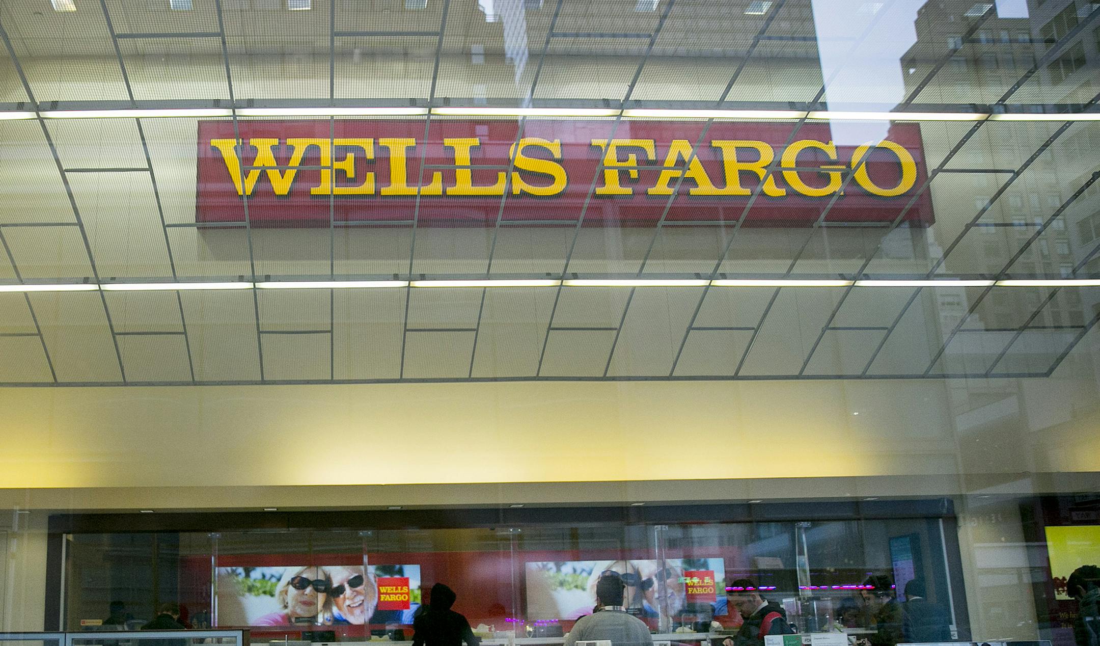 FILE -- A Wells Fargo bank branch in New York, April 7, 2017. About one million people who took out car loans from Wells Fargo were charged for auto insurance they did not need, collision damage coverage that pushed roughly 274,000 Wells Fargo customers into delinquency and resulted in almost 25,000 wrongful vehicle repossessions, according to the internal report. (Sam Hodgson/The New York Times)