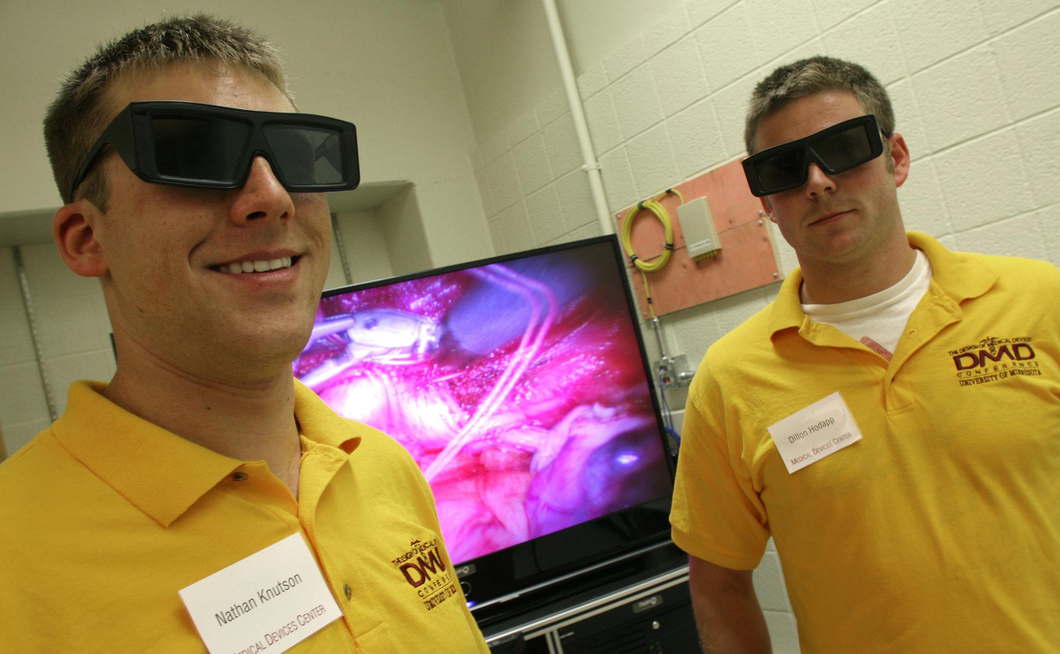 Nathan Knutson, left, and Dillon Hodapp, University of Minnesota mechanical engineering graduate students, modeled 3-D glasses that let students view live surgeries in 3-D.
