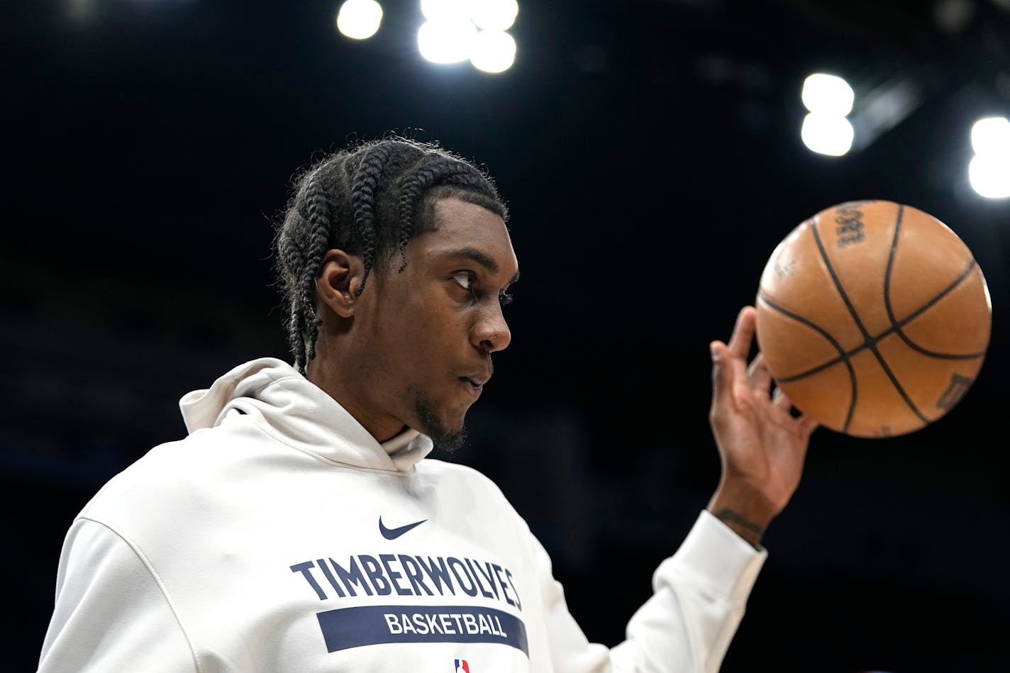 Minnesota Timberwolves forward Jaden McDaniels warms up before an NBA basketball game against the New Orleans Pelicans, Sunday, April 9, 2023, in Minneapolis. (AP Photo/Abbie Parr)