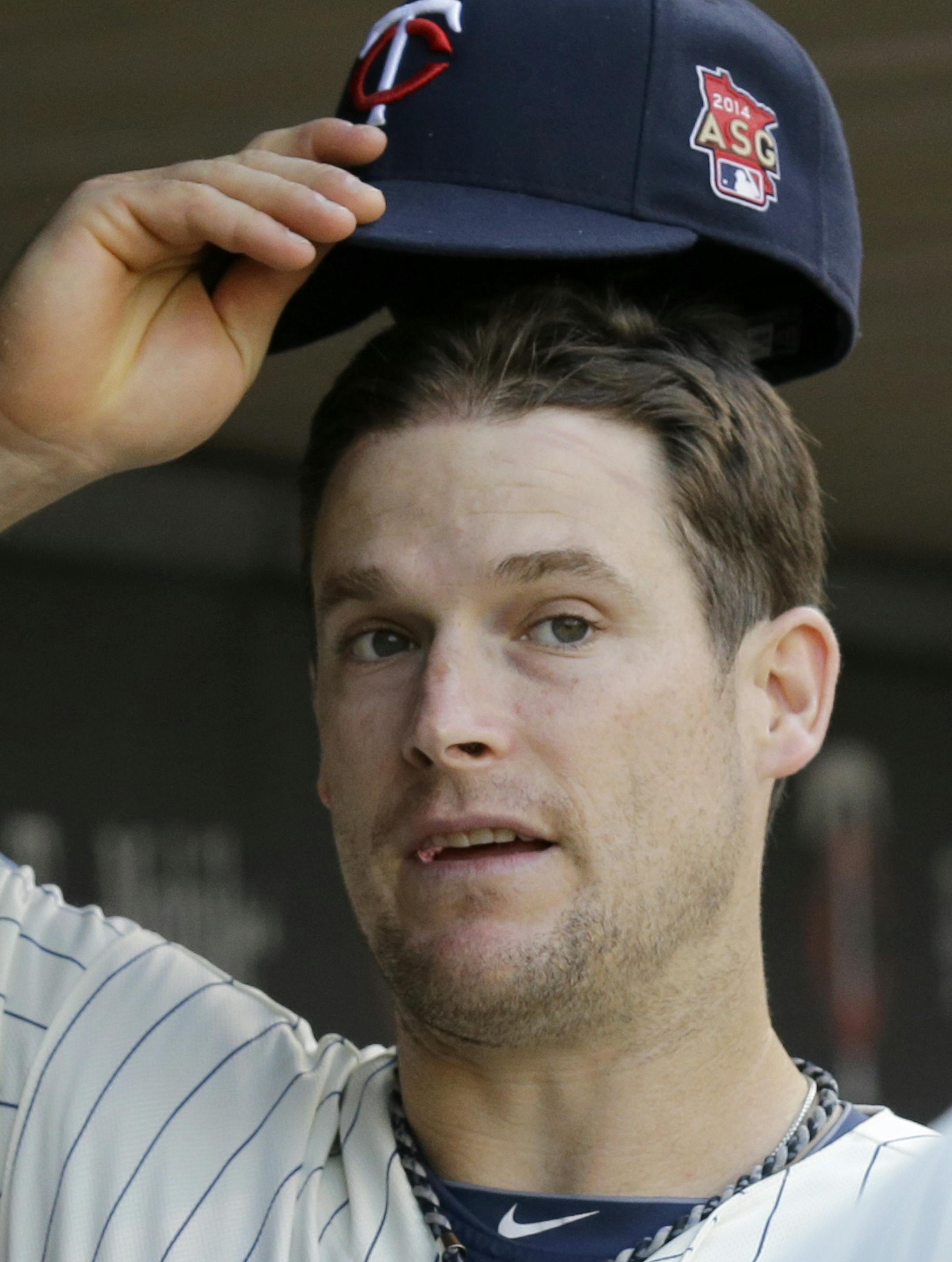 Minnesota Twins left fielder Josh Willingham talks with a teammate before the first inning of a baseball game against the Chicago White Sox in Minneapolis, Saturday, July 26, 2014. (AP Photo/Ann Heisenfelt)