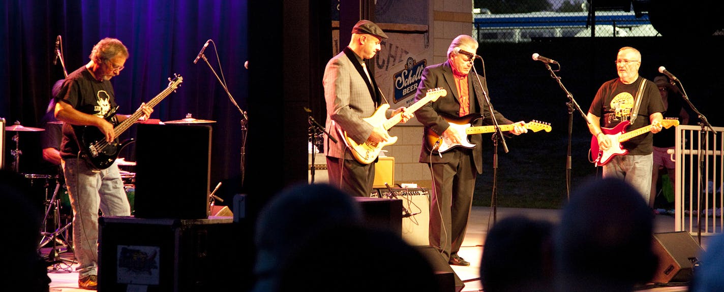 The Trashmen performed with California guitarist Deke Dickerson last summer at the State Fair. From left: Bob Reed, Dickerson, Tony Andreason and Dal Winslow. Bob&#x2019;s son Rob Reed plays drums now.