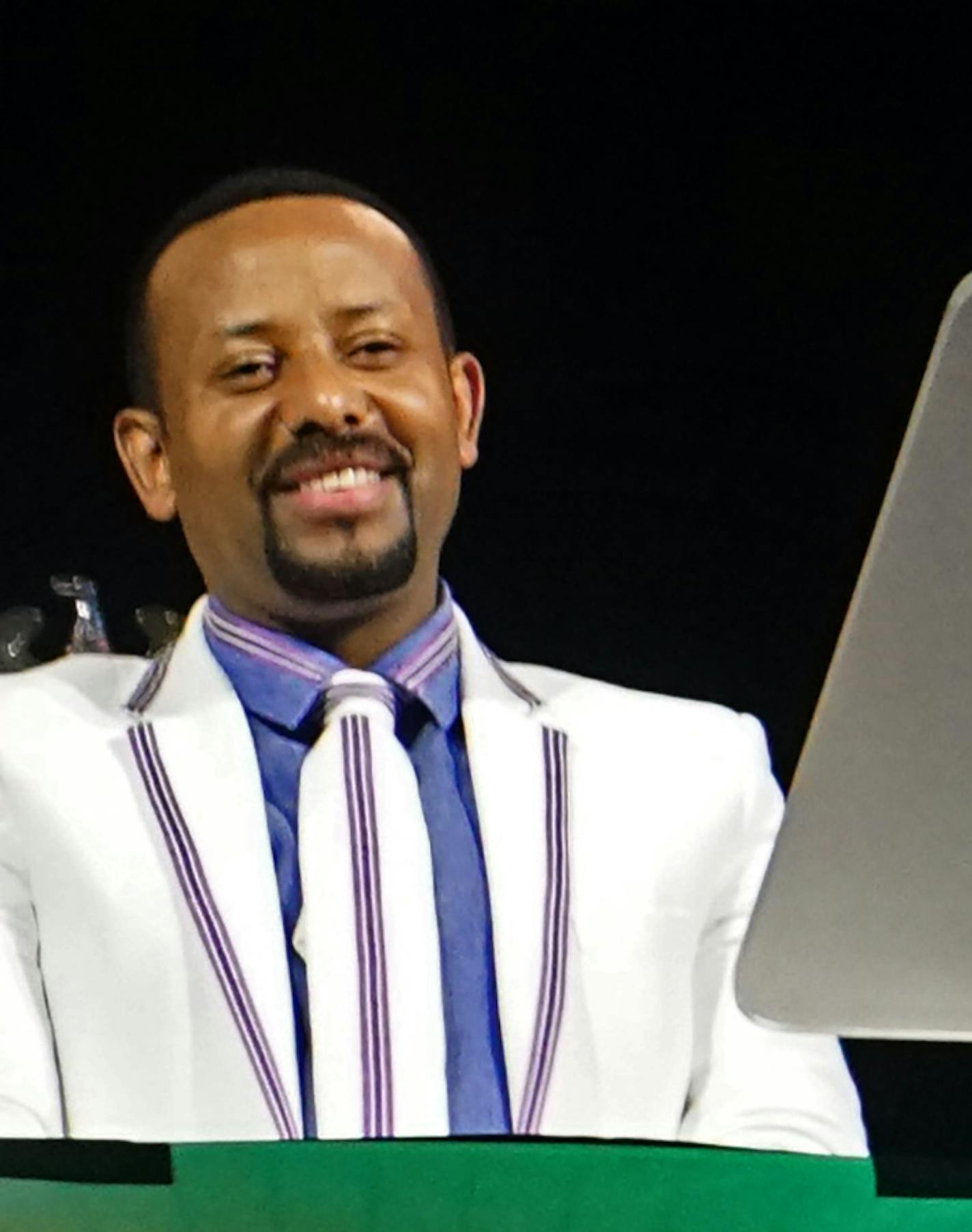 Over ten thousand supporters of Ethiopian Prime Minister Abiy Ahmed, far left, gathered to hear him and celebrate in song and dance. ] Ethiopian PM Abiy Ahmed is speaking at the Target Center. Richard Tsong-Taatarii&#xef;rtsongtaatarii@startribune.com