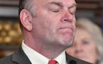 Rep. Dave Baker, R-Willmar closed his eyes as he said he and Senator Eaton can't get their loved ones back as he spoke about the "penny-a-pill" tax pr