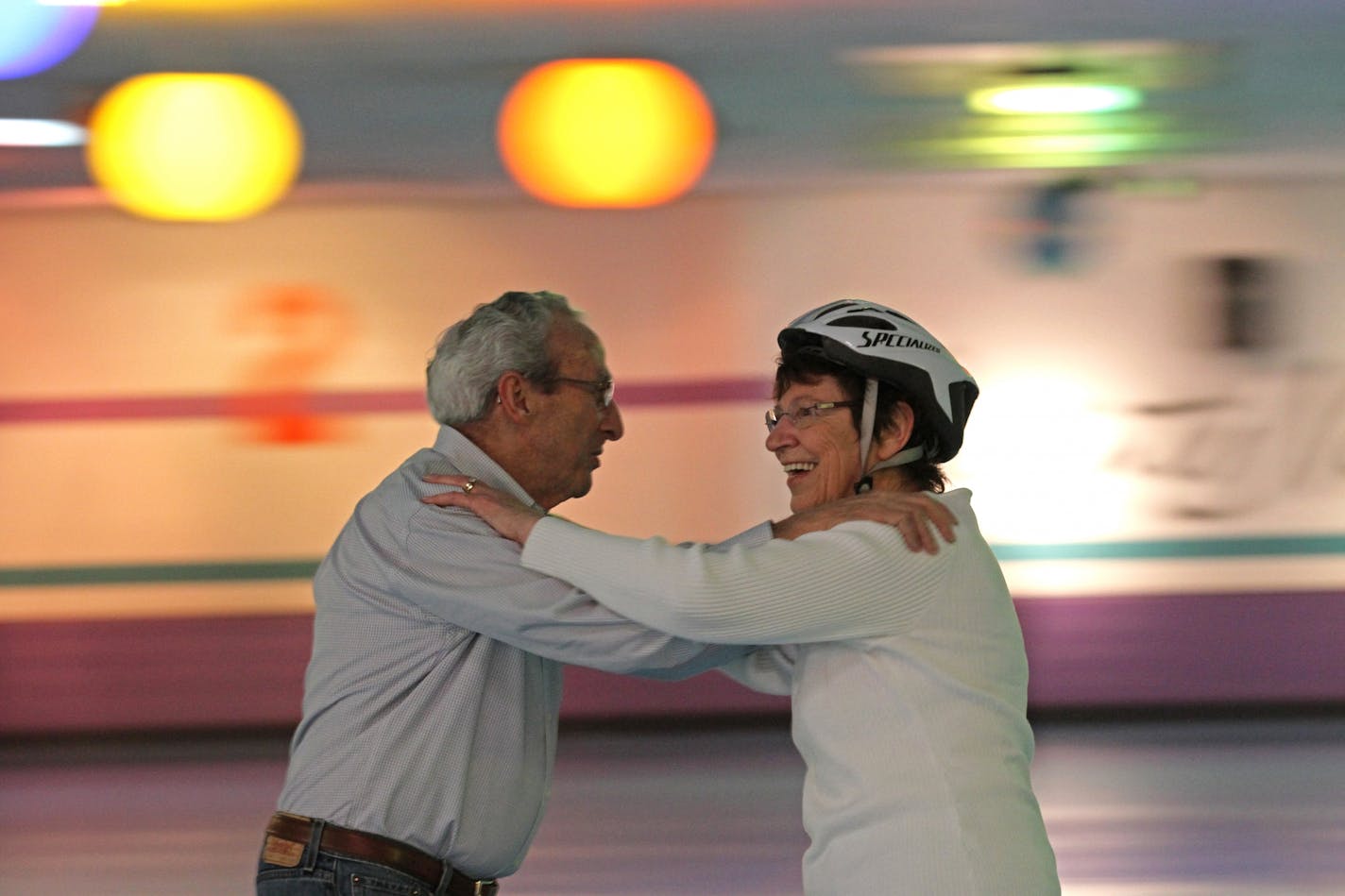 Jack Cotter and Betty Finnie spun their wheels during the "Adult Tea Time" skate session at Saints North in Maplewood.