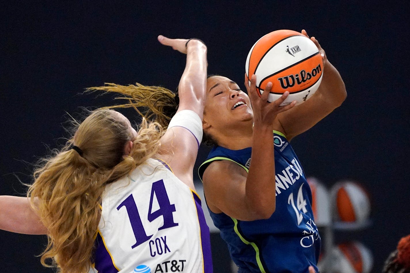 Minnesota Lynx forward Napheesa Collier, right, shoots as Los Angeles Sparks' Lauren Cox defends during the first half of a WNBA basketball game Sunday, July 11, 2021, in Los Angeles. (AP Photo/Mark J. Terrill)