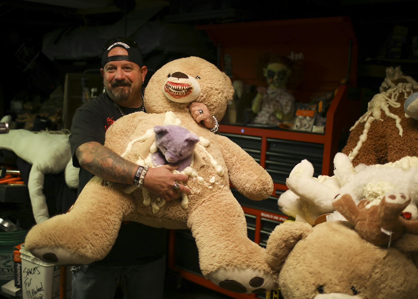 Ed Johnson with some of the nightmare-inducing props in his garage that he has used in previous haunted houses. ] JEFF WHEELER &#xef; jeff.wheeler@startribune.com Ed Johnson has transformed his St. Paul home into a neighborhood Halloween attraction for the past few years. This year the city is requiring him to have a permit and he doesn't think he can meet the requirements in order to be open in time for Halloween. He was photographed at his home in St. Paul Wednesday afternoon, October 5, 2016.