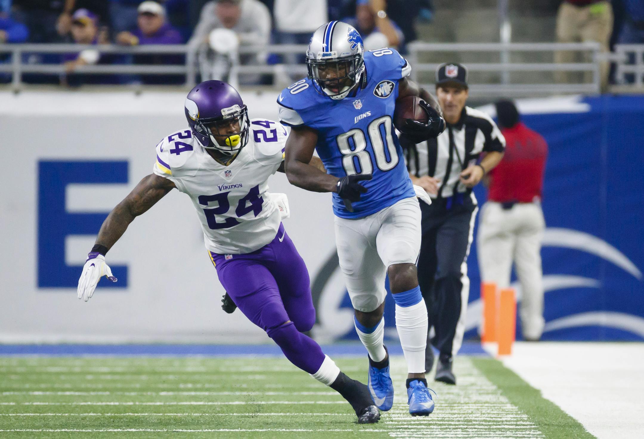 Detroit Lions wide receiver Anquan Boldin (80) is tackled by Minnesota Vikings cornerback Captain Munnerlyn (24) during an NFL football game, Thursday, Nov. 24, 2016 in Detroit. (AP Photo/Rick Osentoski)