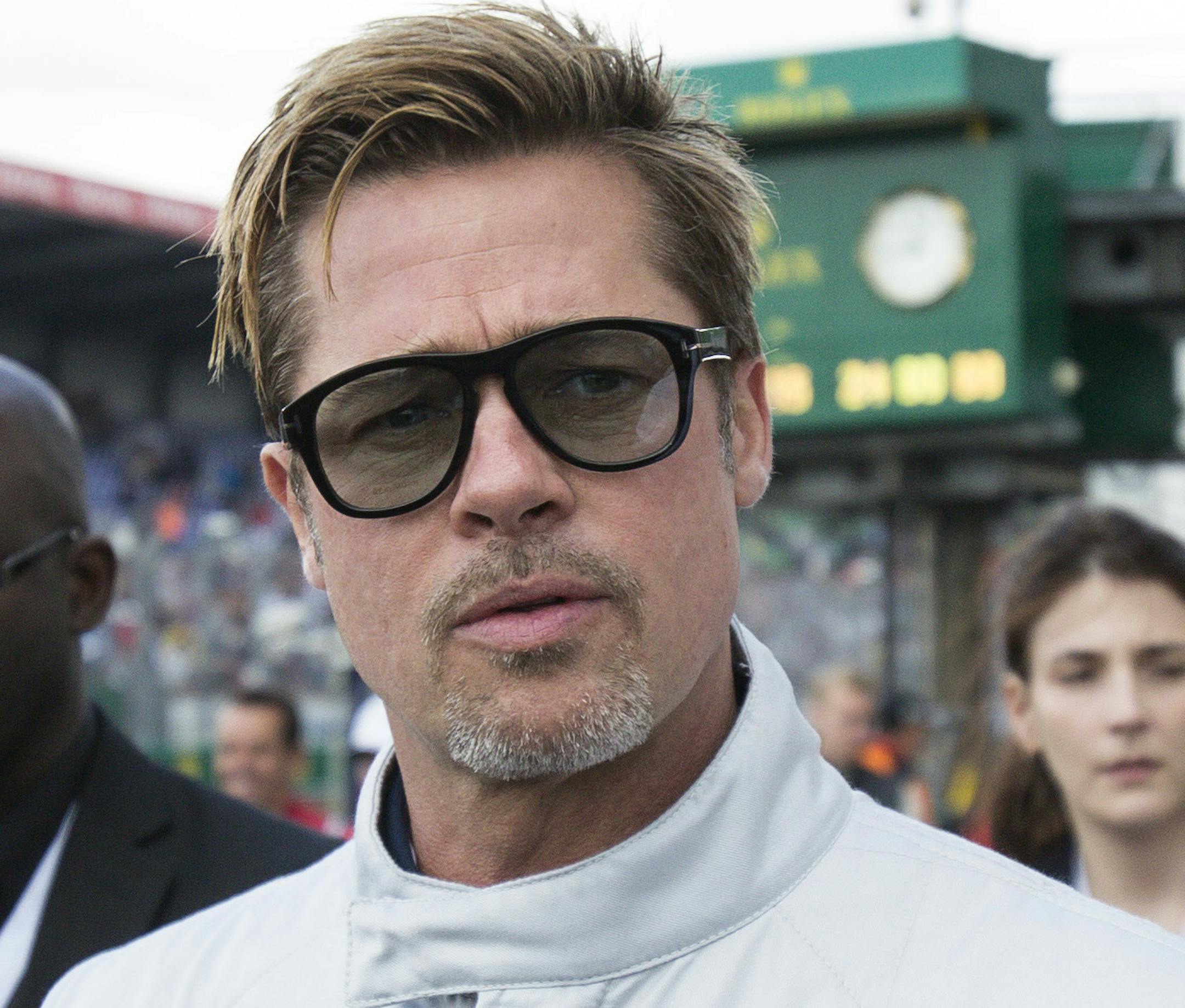 Actor Brad Pitt arrives to start the 84th 24-hour Le Mans endurance race, in Le Mans, western France, Saturday, June 18, 2016. (AP Photo/Kamil Zihnioglu)