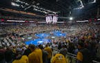 Spectators gather to watch the quarterfinals of the NCAA wrestling championships Friday in Kansas City, Mo.