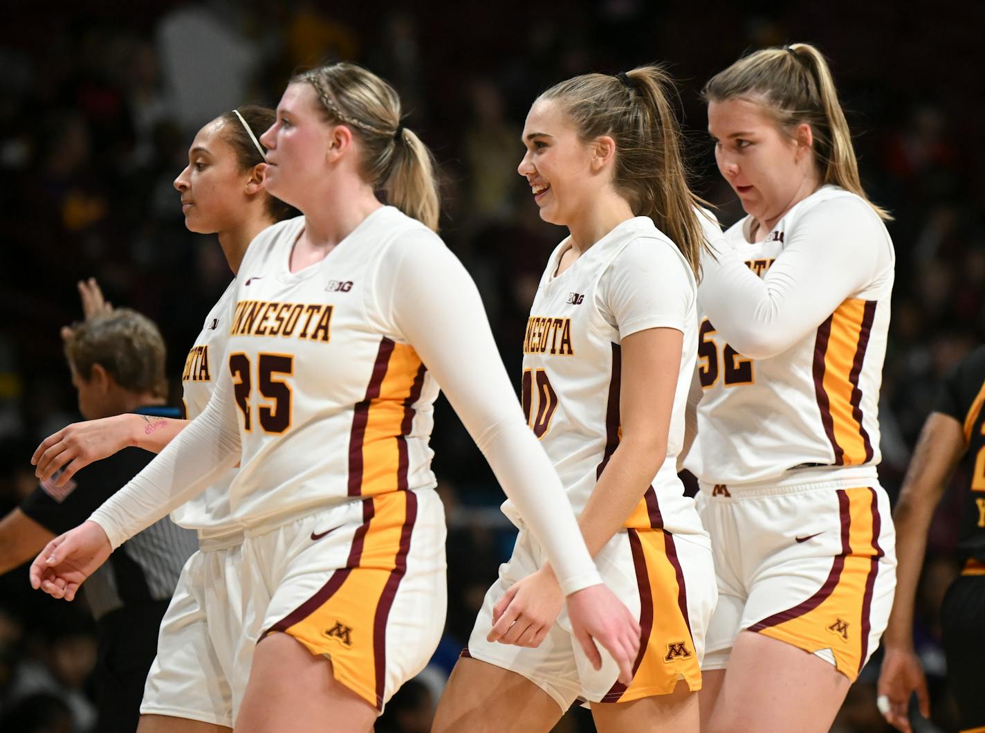 Minnesota Gophers guard Mara Braun (10) smiles as she walks toward the bench after a Grambling timeout in the second half.