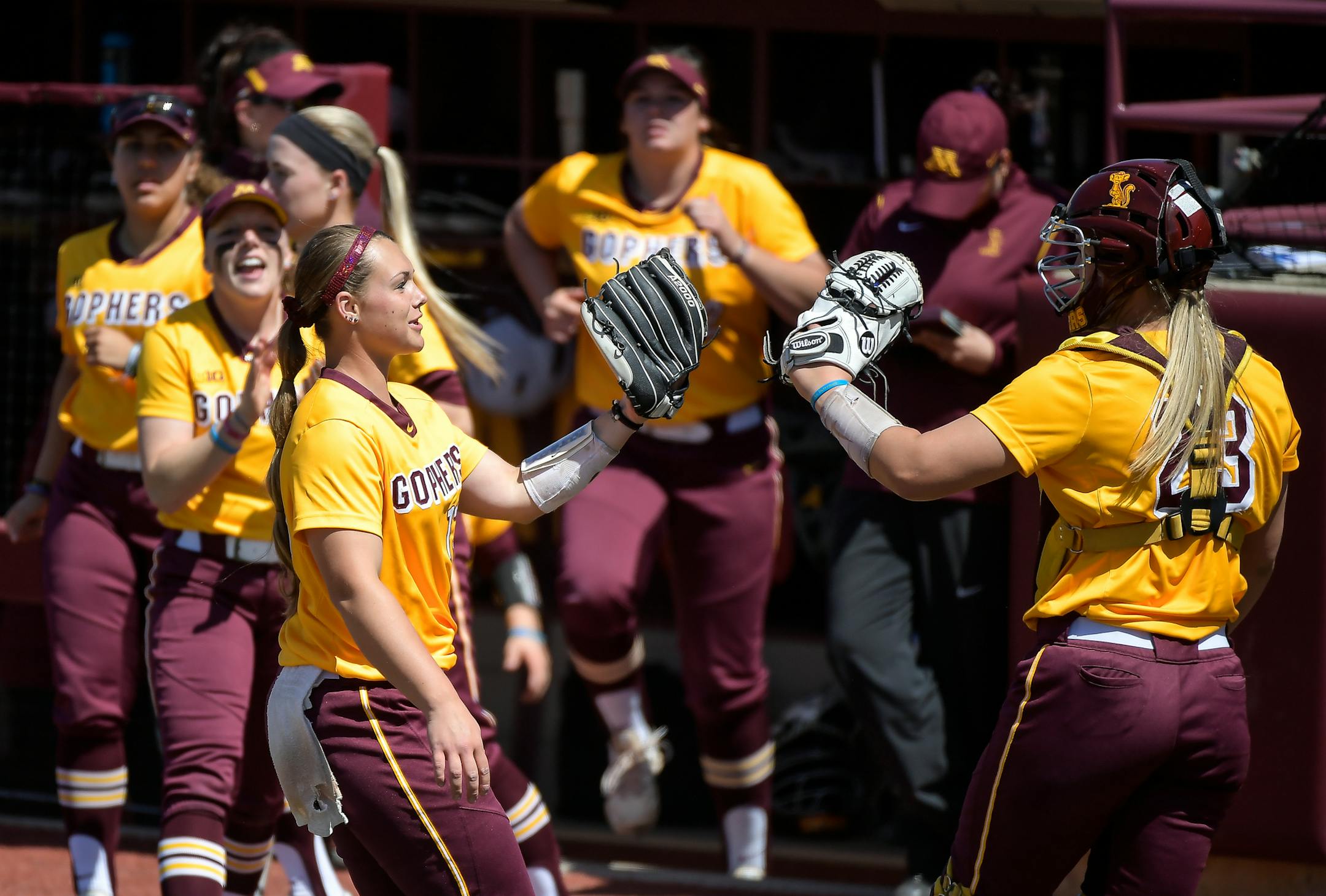 Minnesota starting pitcher Amber Fiser (13) celebrated with catcher Kendyl Lindaman (23) after the end of the third inning against Wisconsin. ] AARON LAVINSKY ï aaron.lavinsky@startribune.com The University of Minnesota Golden Gophers softball team played the University of Wisconsin Badgers in a double header Wednesday, April 25, 2018 at Jane Sage Cowles Stadium in Minneapolis, Minn. ORG XMIT: MIN1804251512120587