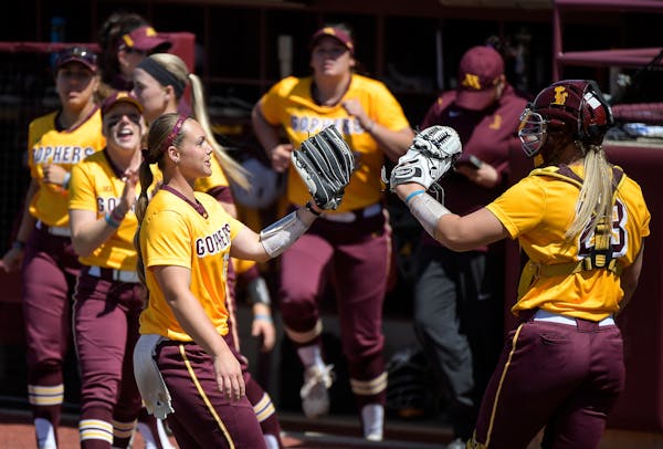 Minnesota starting pitcher Amber Fiser (13) celebrated with catcher Kendyl Lindaman (23) after the end of the third inning against Wisconsin. ] AARON 