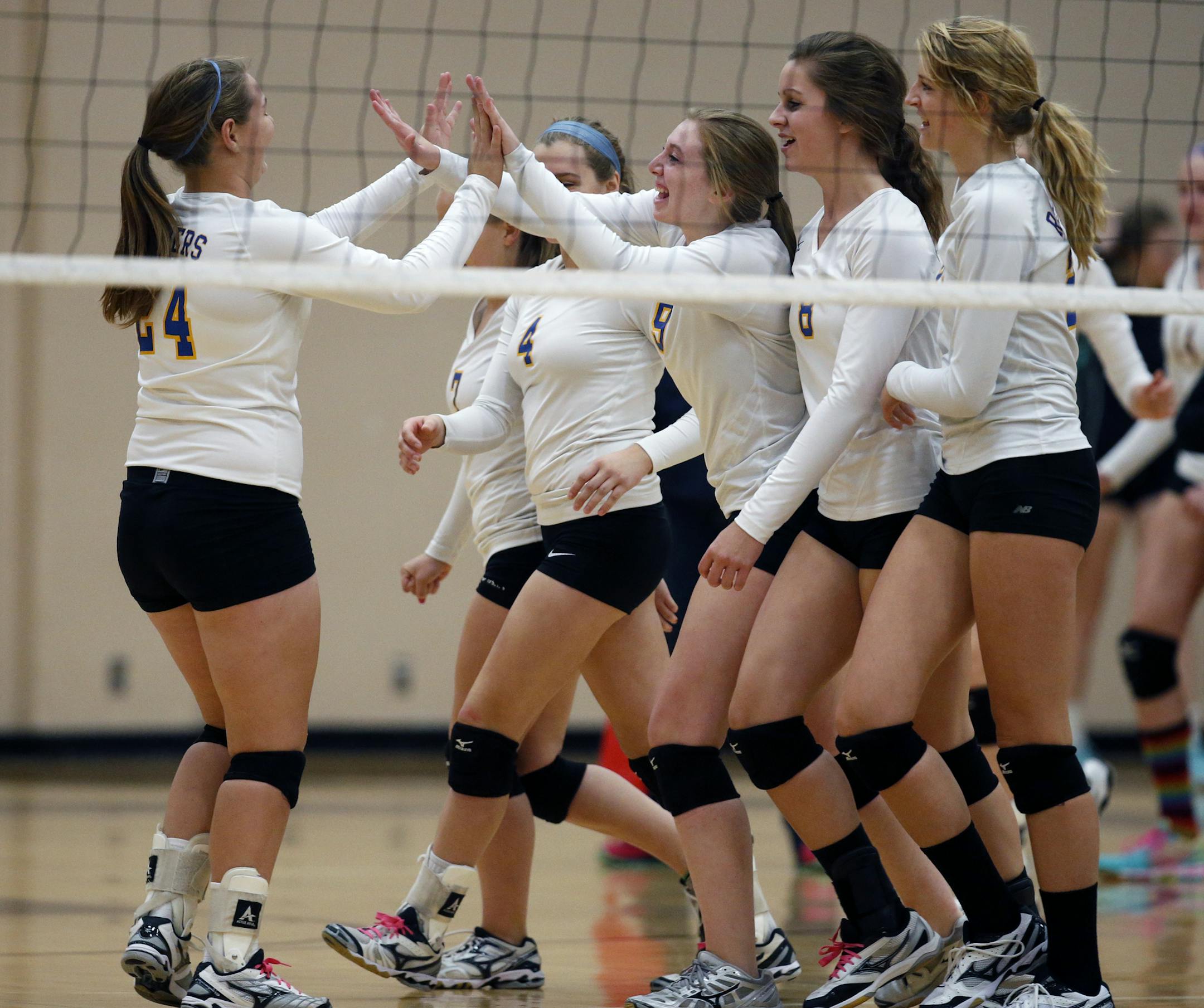 On September 30, 2014 in a game between South St. Paul and Hastings women's volleyball, the Raiders celebrate their straight set victory over the Packers .]Richard Tsong-Taatarii/rtsong- taatarii@startribune.com