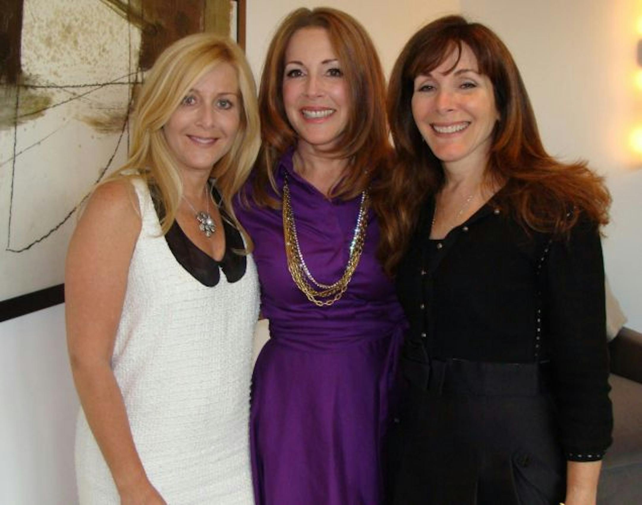 Sisters Dana Asher, Jaye Hersh and Wendy Weiss posted at a launch party for HollywoodIntuition at Jean Wright's house in Golden Valley.