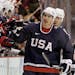 USA's Zach Parise (9) is congratulated after scoring a goal in the third period of a men's quarterfinal round ice hockey game against Switzerland at t
