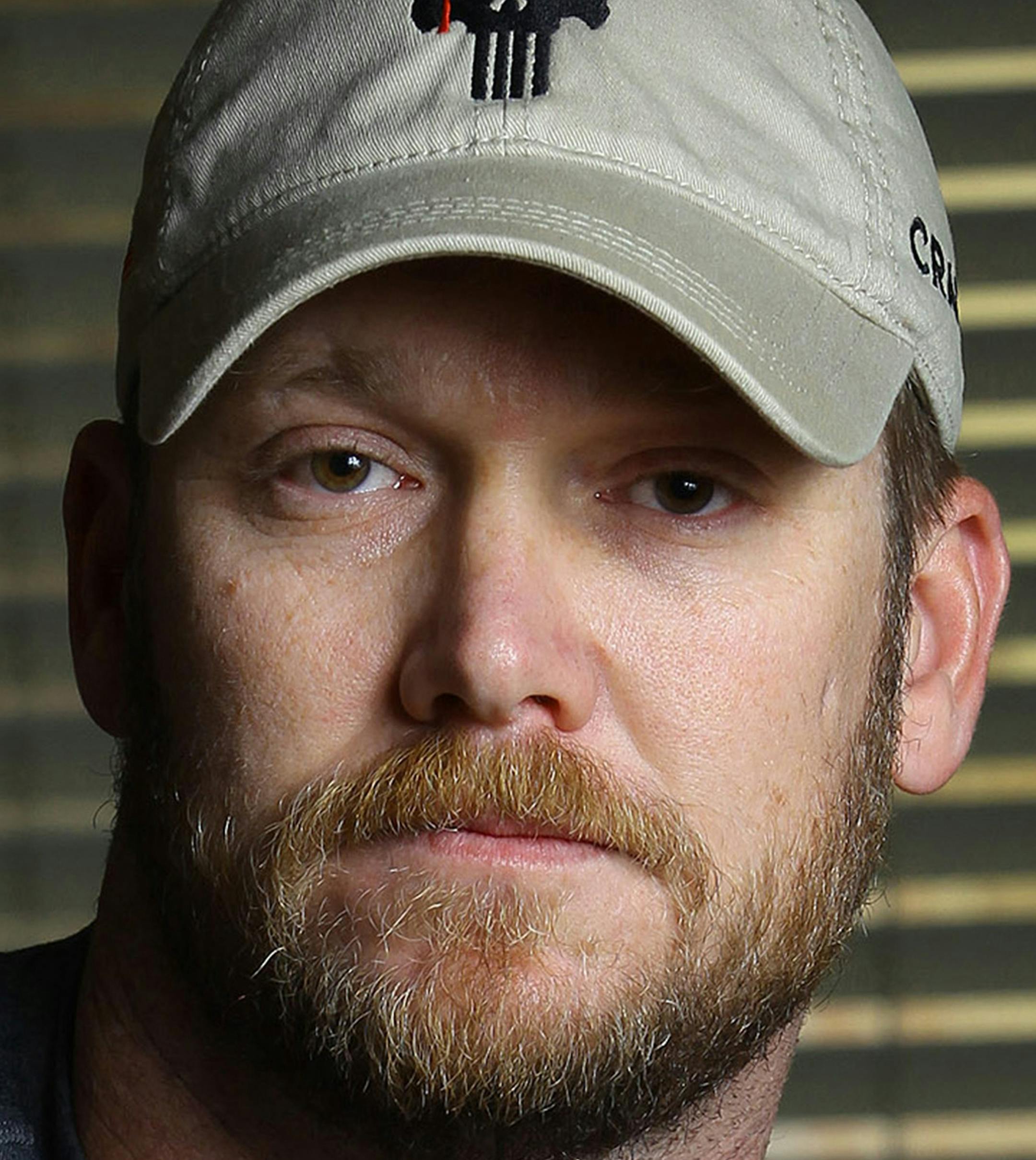 This combination of file photos shows Chris Kyle, left, former Navy SEAL and author of the book √¨American Sniper,√Æ on April 6, 2012, and former Minnesota Gov. Jesse Ventura, right, on Sept. 21, 2012. Ventura asked a judge Monday, June, 17, 2013, to allow his defamation lawsuit against the slain author to go forward by substituting Kyle√≠s widow as the defendant. In part of the book, Kyle claims he decked Ventura in 2006 over unpatriotic remarks he says Ven
