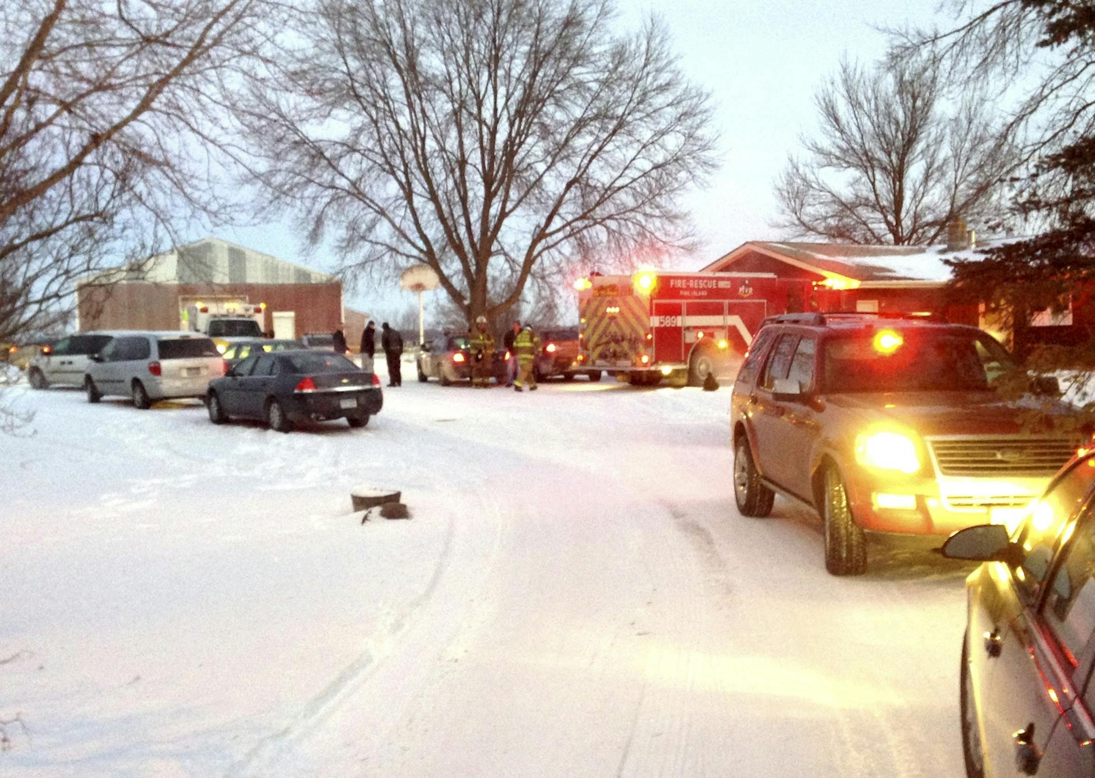 Olmsted County law enforcement and Pine Island Fire and Rescue respond to the scene on the 6900 block of 100th St. NW. in Pine Island, Minn., where two individuals had been shot.
