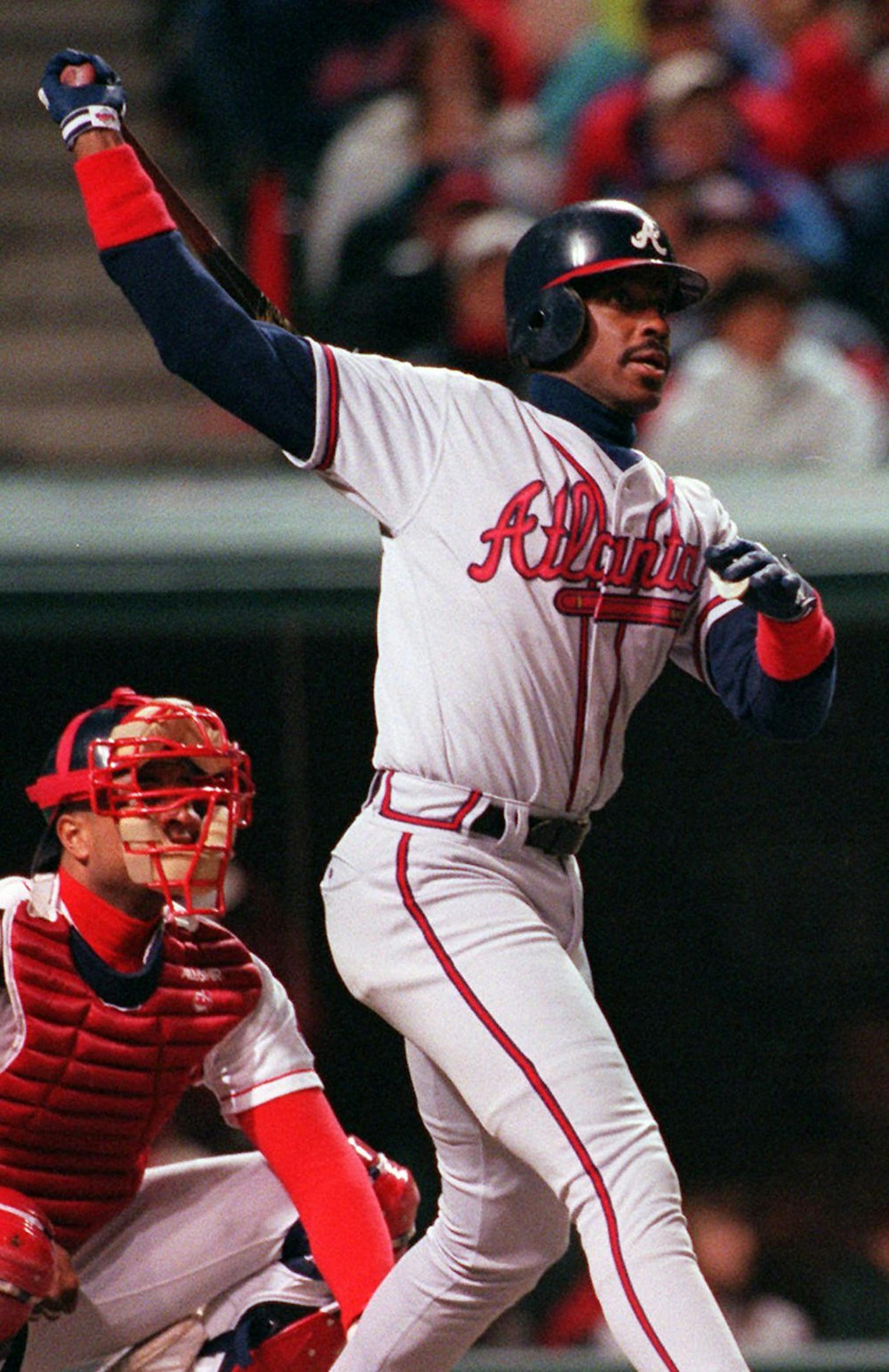 Atlanta Braves' Fred McGriff watches his solo home run in the sixth inning of Game Three of the World Series against the Cleveland Indians at Jacobs Field in Cleveland, Tuesday, Oct. 24, 1995. Behind the plate is Indians Sandy Alomar. (AP Photo/Mark Duncan)