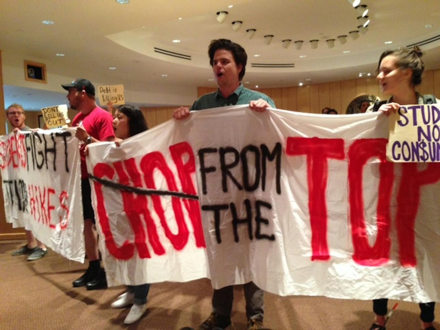 Protesters disrupted the University of Minnesota regents meeting Friday morning. Six were arrested for refusing to leave when ordered by police.