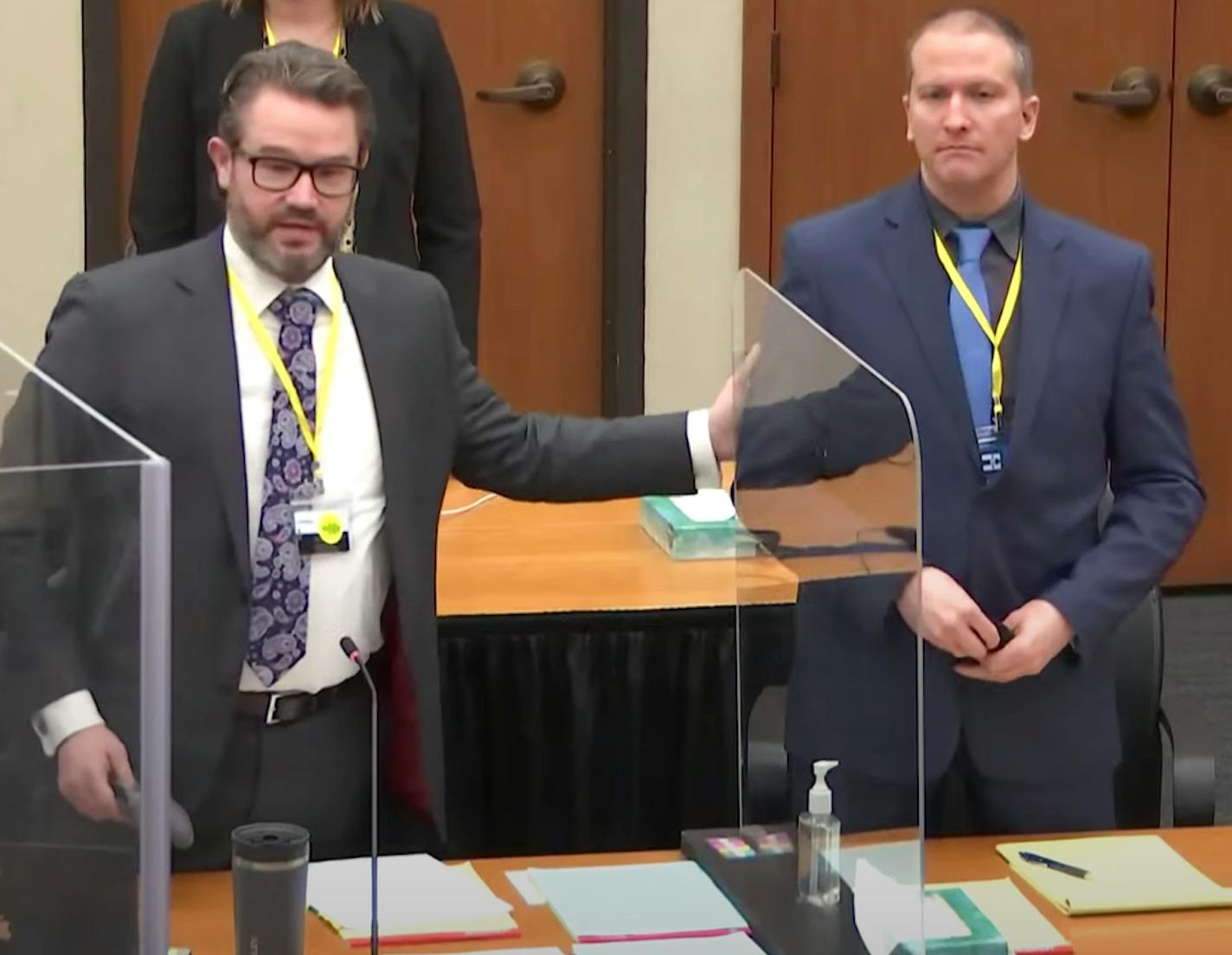 In this image from video, defense attorney Eric Nelson and defendant Derek Chauvin spoke before jury selection Monday, March 15, 2021, as jury selection resumed in the trial of former Minneapolis police officer Derek Chauvin at the Hennepin County Courthouse in Minneapolis. Defense is seeking a continuance after news of the $27 million civil settlement the city of Minneapolis reached last week with the family of George Floyd.