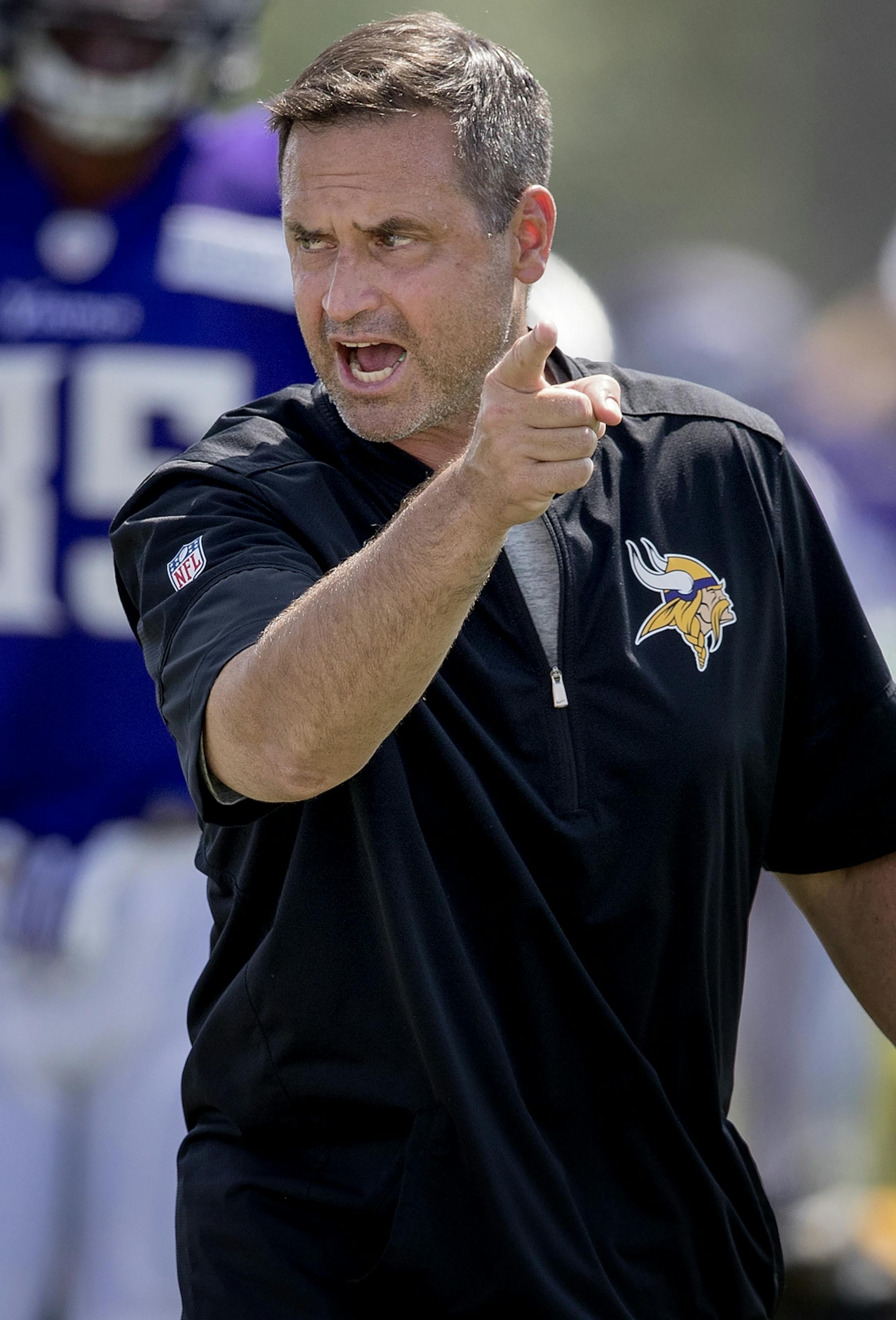Special teams coach Mike Priefer pass during the afternoon practice.