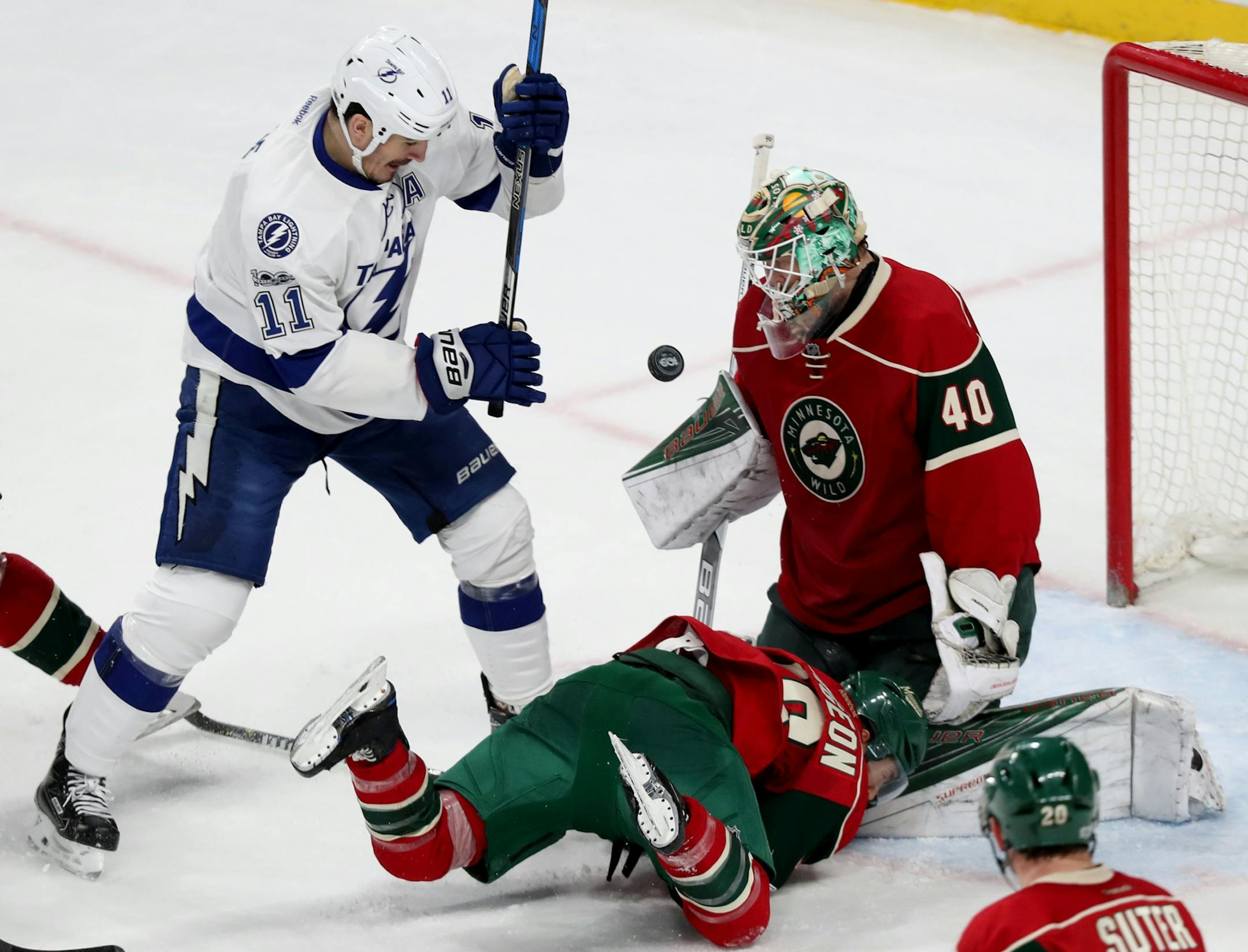 Minnesota Wild goalie Devan Dubnyk (40) makes a save on a shot by Tampa Bay's Brian Boyle (11) during the third period of the Wild's 2-1 shootout win Friday, Feb. 10, 2017, at the Xcel Energy Center in St. Paul, MN.