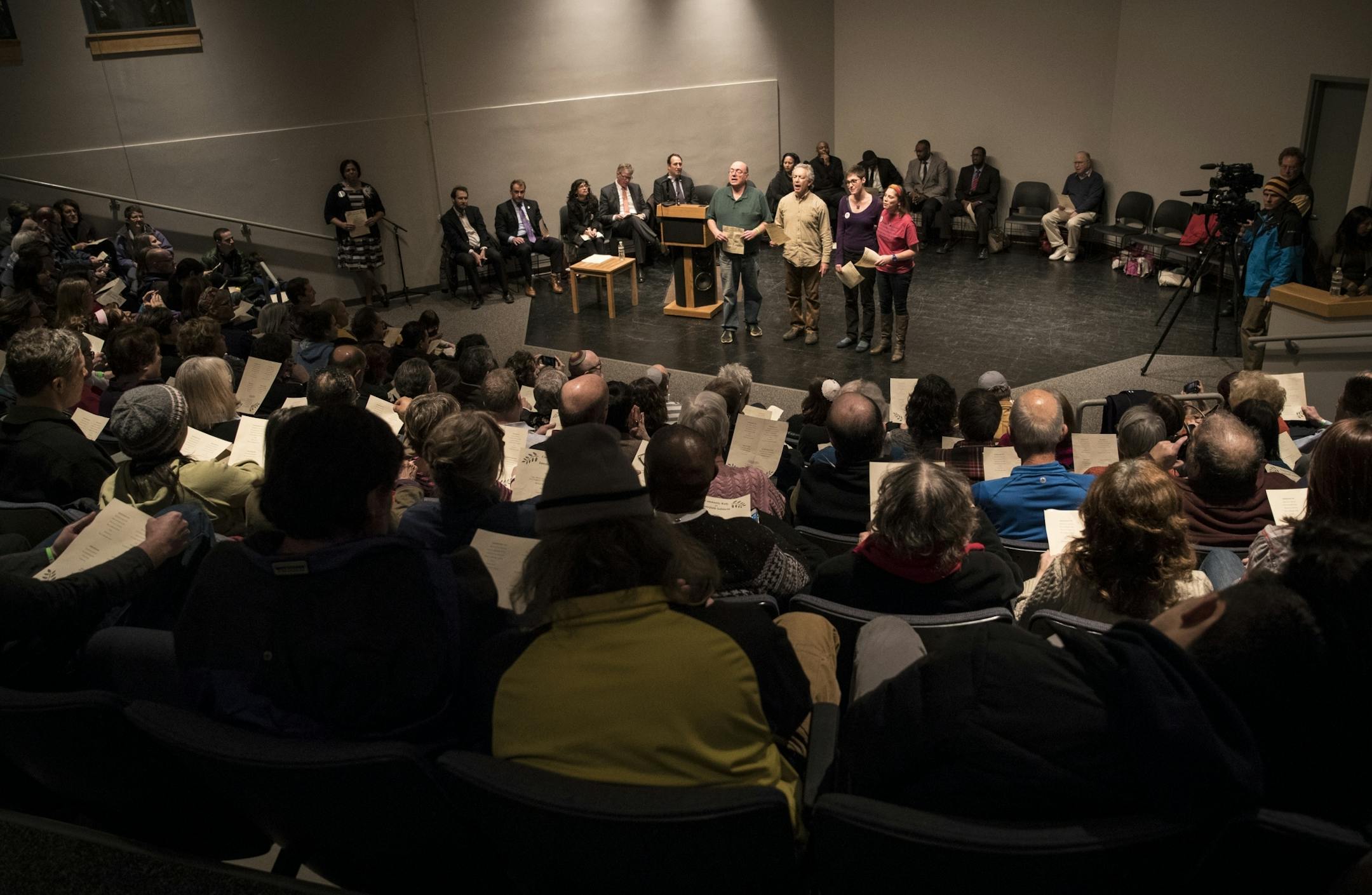 A group of people led a sing-a-long to the hebrew song Hineh Mah Tov at the beginning an interfaith rally at the Highland Park Community Center on Thursday, March 2, 2017, in St. Paul, Minn.