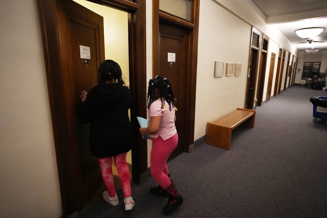 Davina Parker and her daughter Jazmere, 7, returned to their room in the Project Home at the Provincial House.