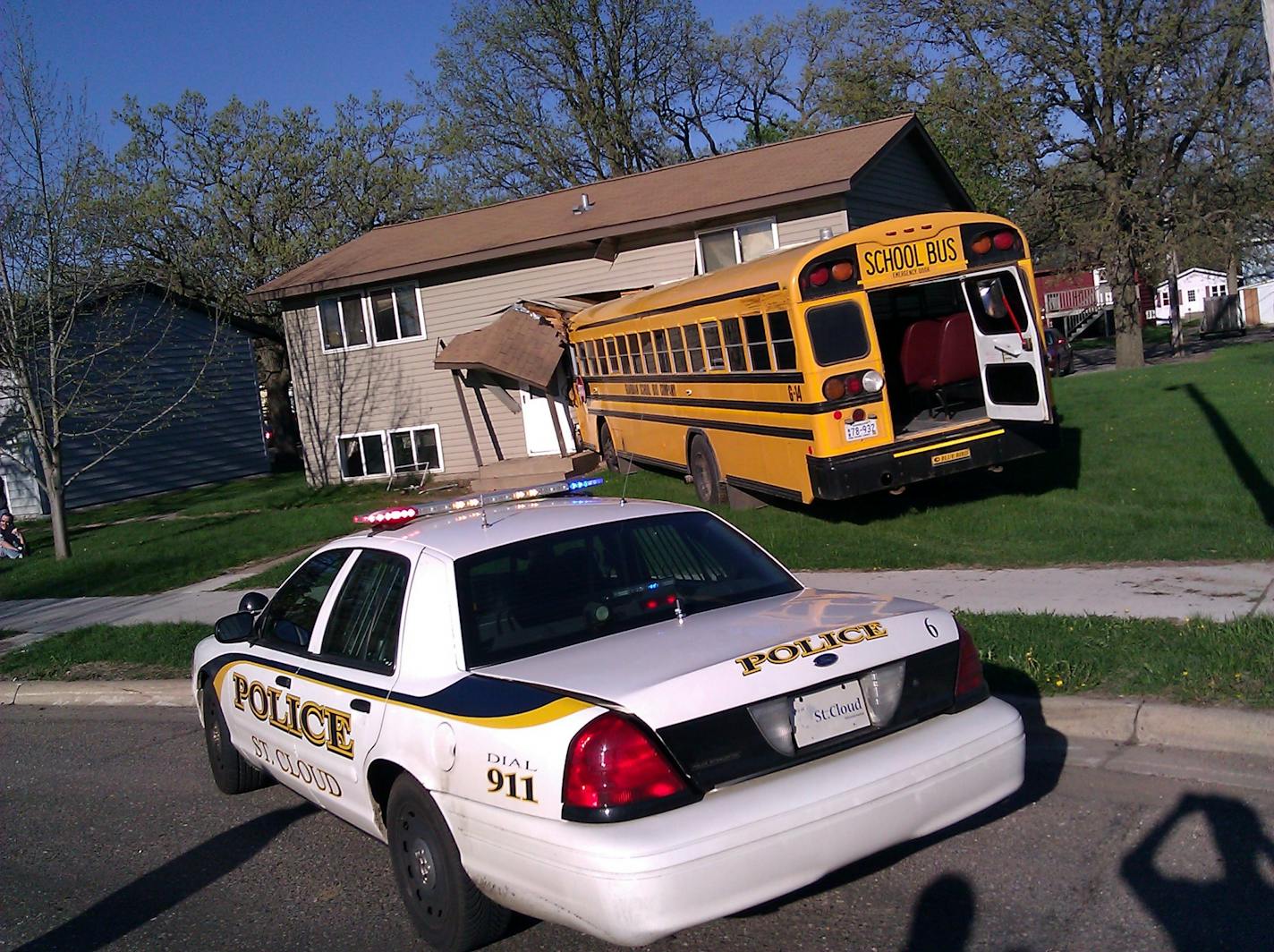 A school bus crashed into a duplex, Monday, after the bus collided with a taxi and went into the building in St. Cloud, Minn.