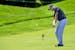 Bill Haas hits his approach shot on the par-5 sixth hole during the third round of the AT&T National at Congressional Country Club in Bethesda, Maryla