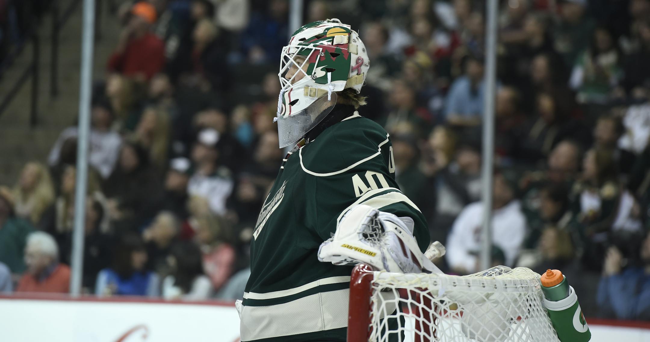 Minnesota Wild goalie Devan Dubnyk (40) watches during a break in the second period of an NHL hockey game against the Arizona Coyotes Saturday, Jan. 17, 2015, in St. Paul, Minn. The Wild won 3-1. (AP Photo/Hannah Foslien)