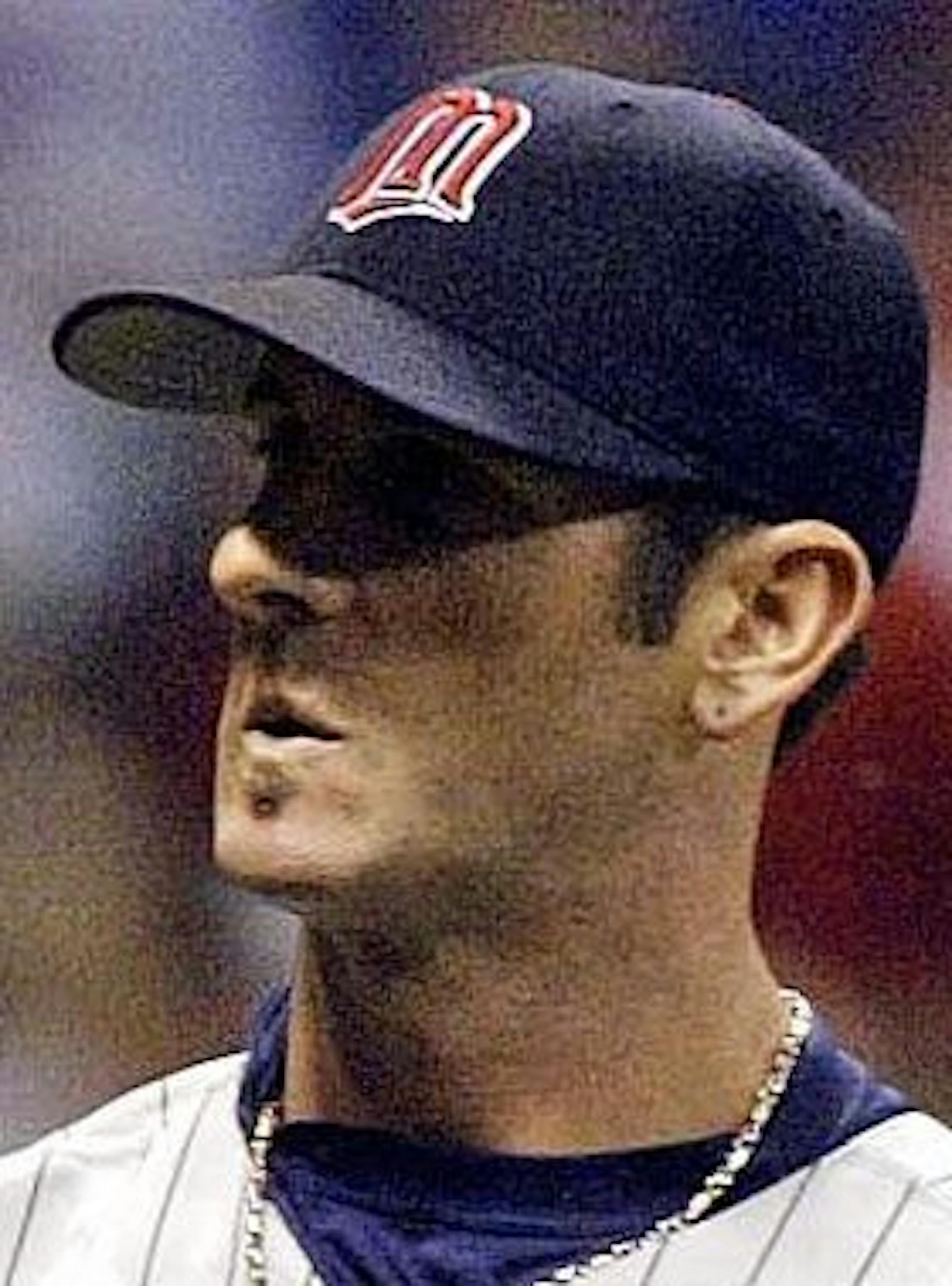 Minnesota Twins' reliever Grant Balfour looks back to home plate as Milwaukee Brewers' Junior Spivey jogs home in the seventh inning Friday, June 18, 2004, in Milwaukee. Spivey scored from third after Keith Ginter was hit by a pitch with the bases loaded. The Brewers won 4-1. (AP Photo/Morry Gash) ORG XMIT: WIMG104 ORG XMIT: MIN1307151822190931