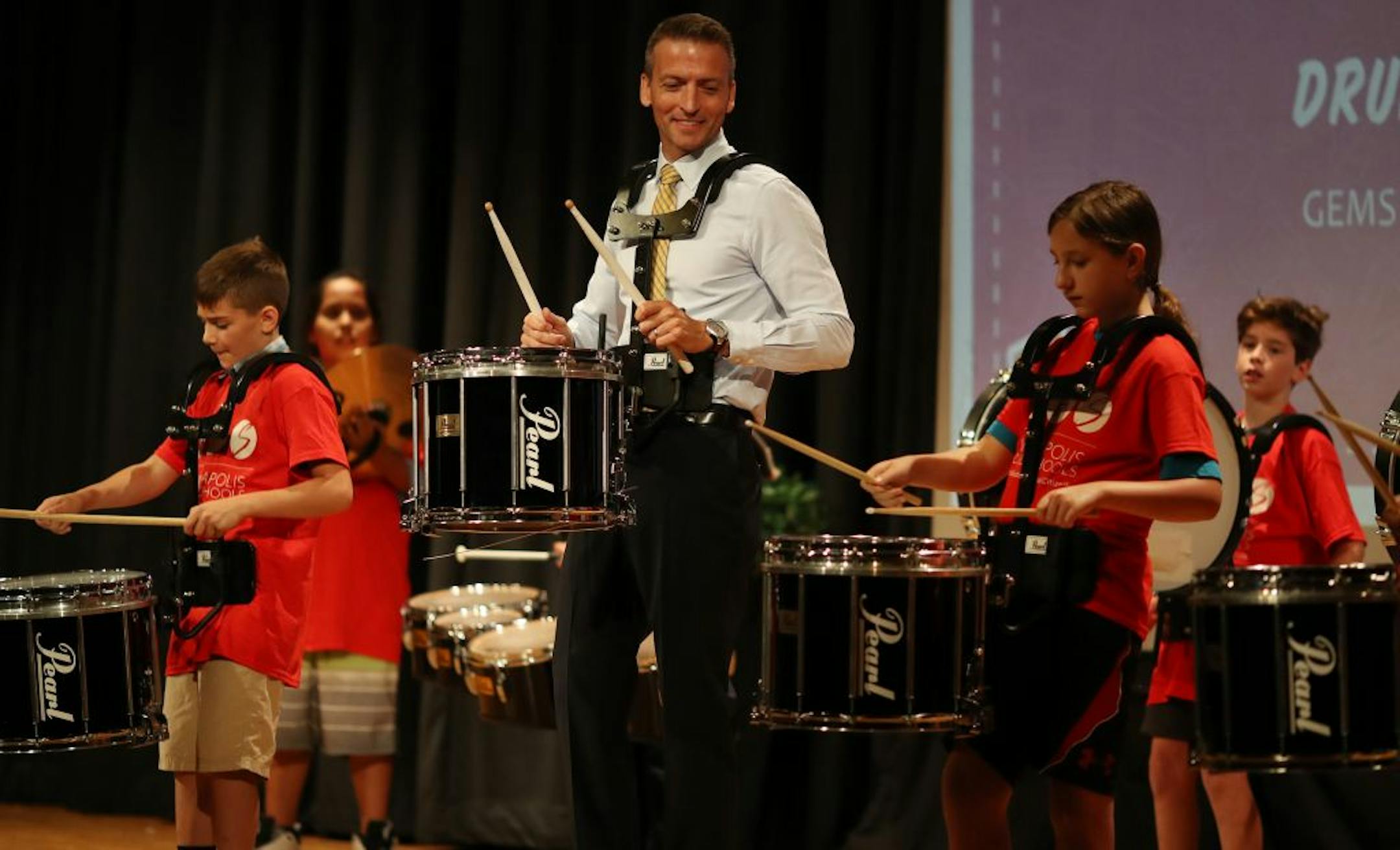 Minneapolis school Superintendent Ed Graff played drums with members of the Gems and Gise drum group after giving his state of the schools address Monday August 20, 2018 at North Community High School in Minneapolis, MN.