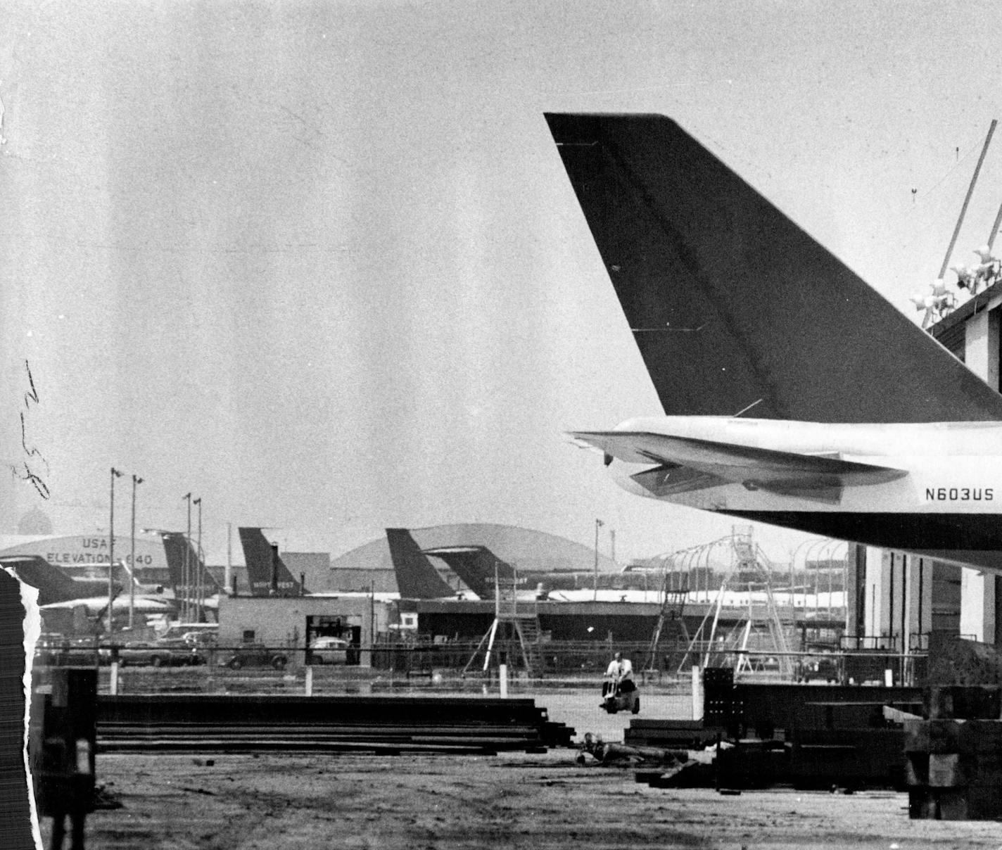 May 30, 1970 747 ' In Shop ' at Twin Cities Airport The tail of a giant Boeing 747 extended from a Northwest Airlines hangar Friday at(Minneapolis-St. Paul International Airport, where two of the $22-million aircraft are undergoing engine repairs. The 231-foot-long plane's tail measures 63 feet from the ground, while the hangar door is about 45 feet high. Engine difficulties have caused cancellation of a V.I.P. flight scheduled for Monday, and a Northwest spokesman said yesterday that "it would