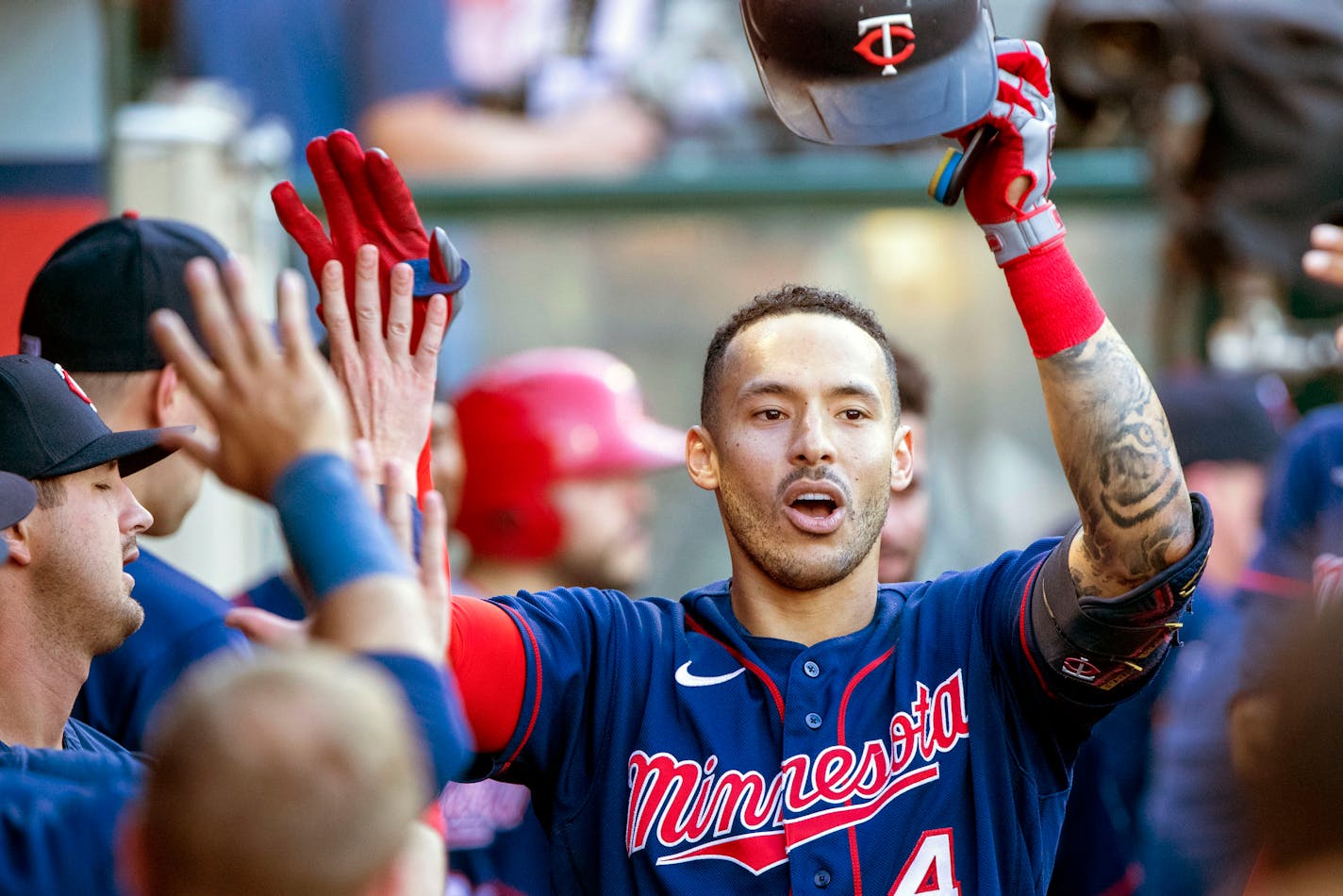 Minnesota Twins' Carlos Correa, right, is congratulated after hitting a solo home run against the Los Angeles Angels during the first inning of a baseball game in Anaheim, Calif., Saturday, Aug. 13, 2022. (AP Photo/Alex Gallardo)