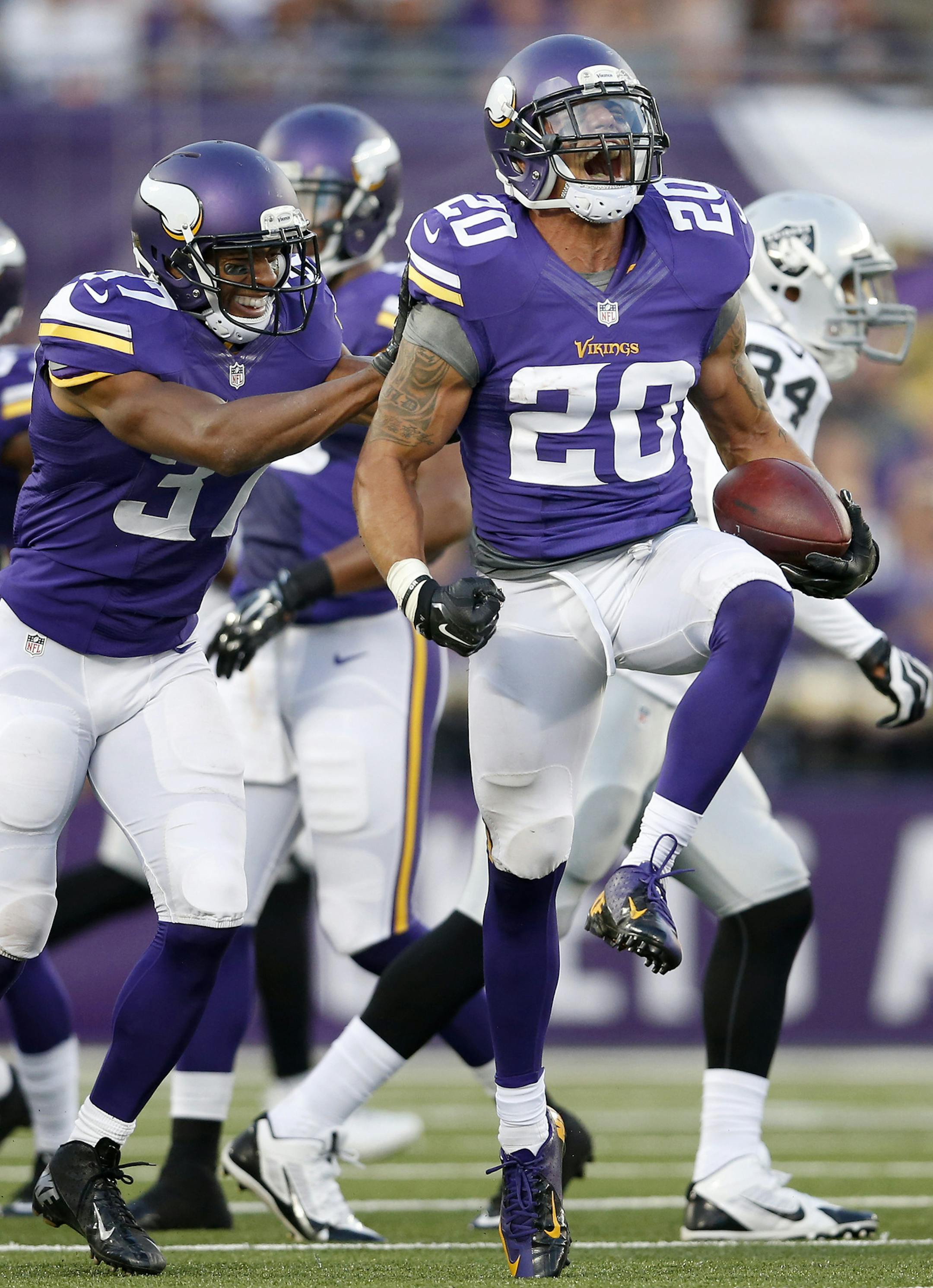 Minnesota Vikings Kurt Coleman (20) celebrated after intercepting a Derek Carr pass intended for Jamize Olawale (49) in the second quarter. ] CARLOS GONZALEZ cgonzalez@startribune.com - August 8, 2014 , Minneapolis, Minn., NFL, TCF Bank Stadium, Minnesota Vikings vs. Oakland Raiders.