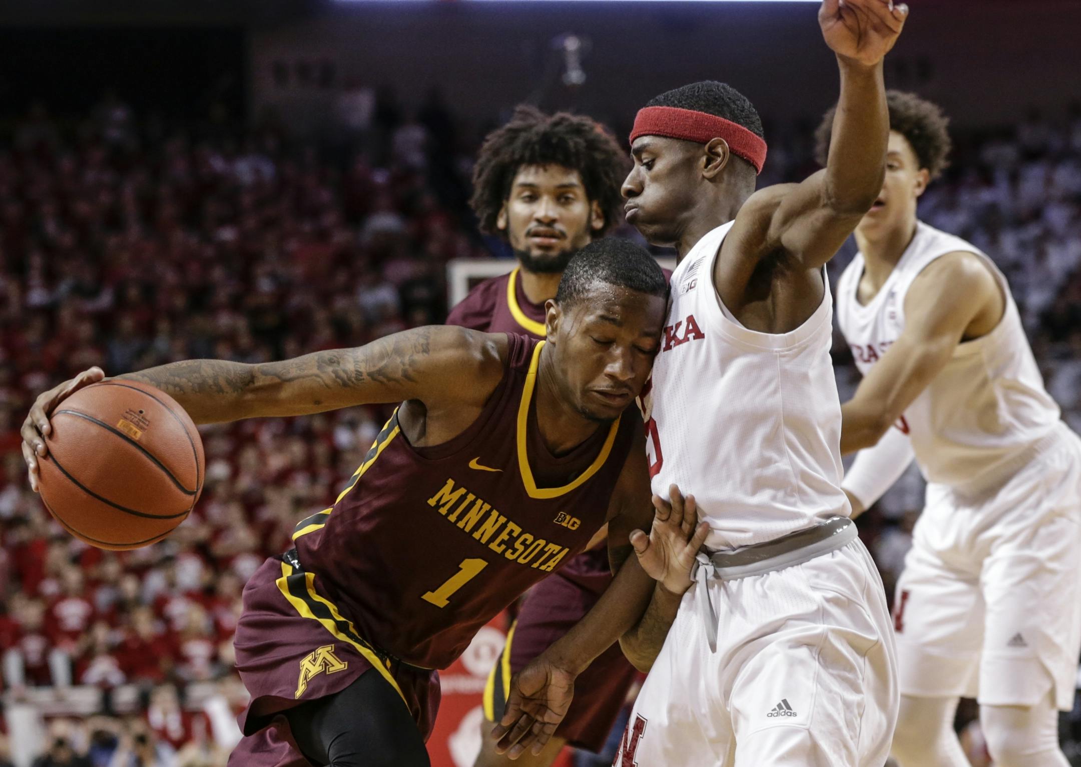 Minnesota's Dupree McBrayer (1) tries to get around Nebraska's Glynn Watson Jr. (5) during the first half of an NCAA college basketball game in Lincoln, Neb., Tuesday, Dec. 5, 2017.