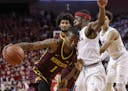 Minnesota's Dupree McBrayer (1) tries to get around Nebraska's Glynn Watson Jr. (5) during the first half of an NCAA college basketball game in Lincol