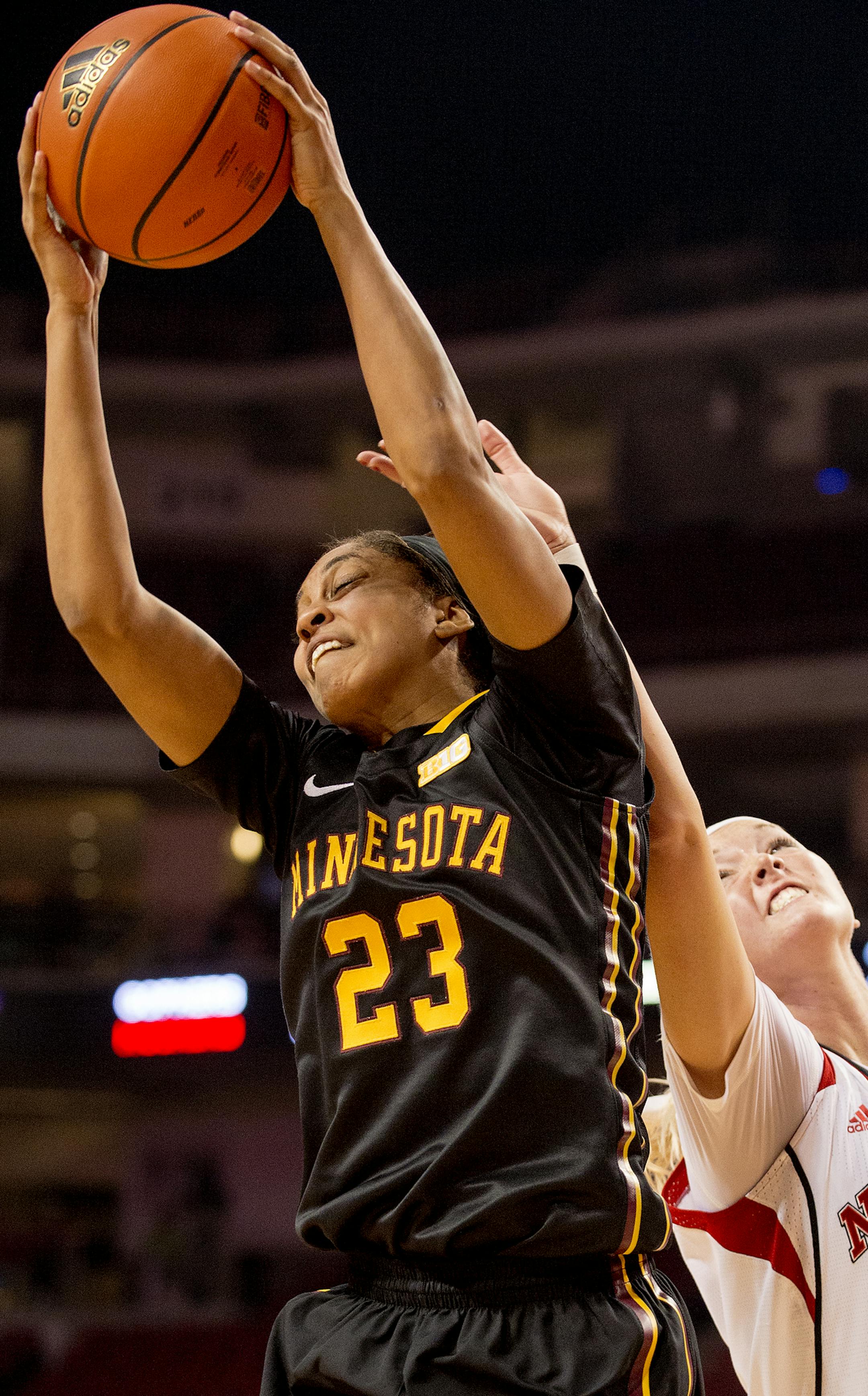 Minnesota forward Shae Kelley (23) pulls in the rebound in front of Nebraska forward Emily Cady (23) in the second half of an NCAA college basketball game Tuesday, Feb. 24, 2015, in Lincoln, Neb. (AP Photo/The Journal-Star, Francis Gardler)