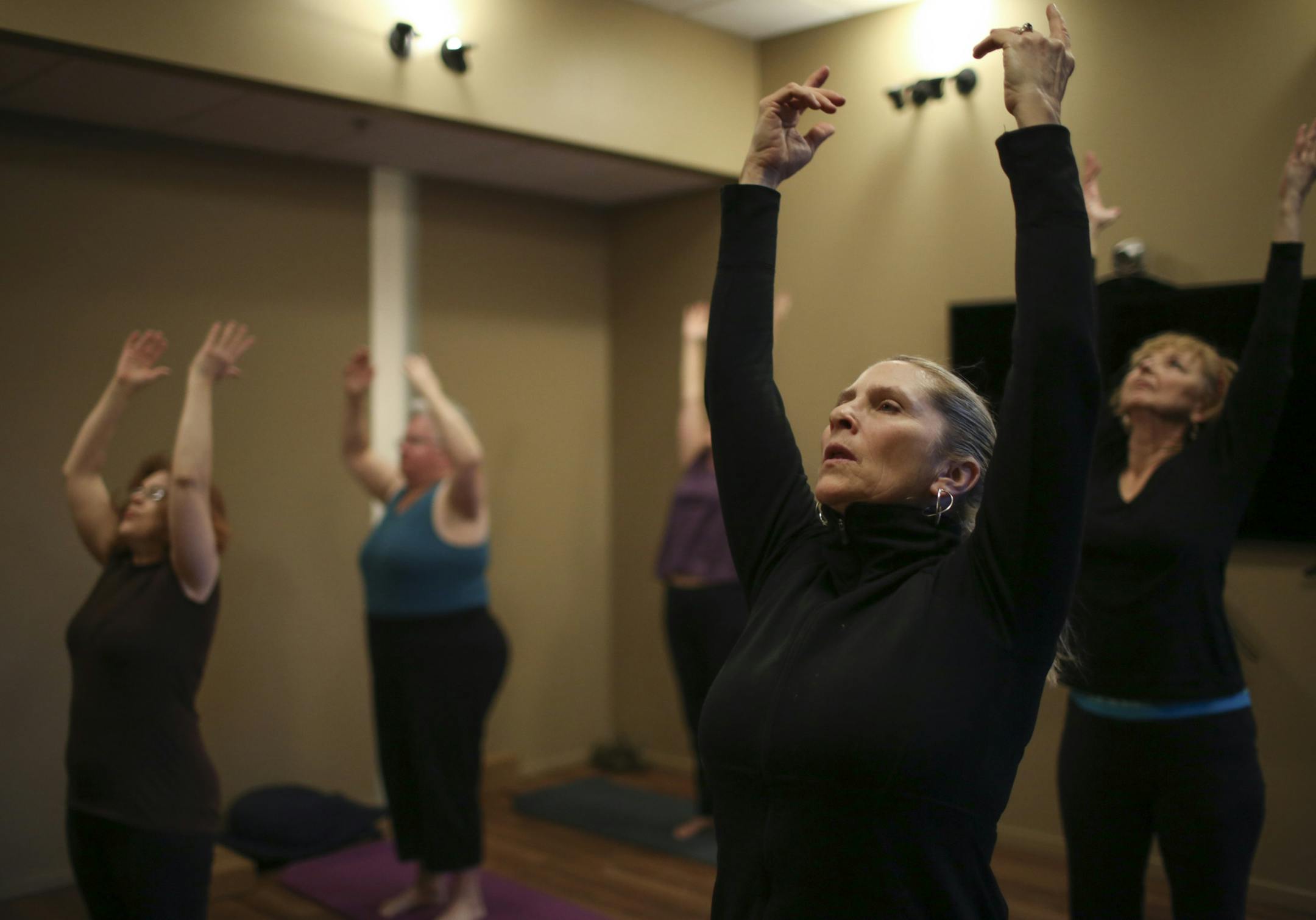 Sally Wheaton Hushcha, foreground, with other participants in Camille Gage's gentle Hatha yoga class Tuesday afternoon. ] JEFF WHEELER ‚Ä¢ jeff.wheeler@startribune.com The practice of yoga has nearly doubled in a decade as people seek ways to reduce stress, alleviate chronic pain and improve their outlook on life, according to a new nationwide survey by federal health agencies. Camille Gage led a gentle Hatha yoga class at the Penny George Institute for Health and Healing in Min